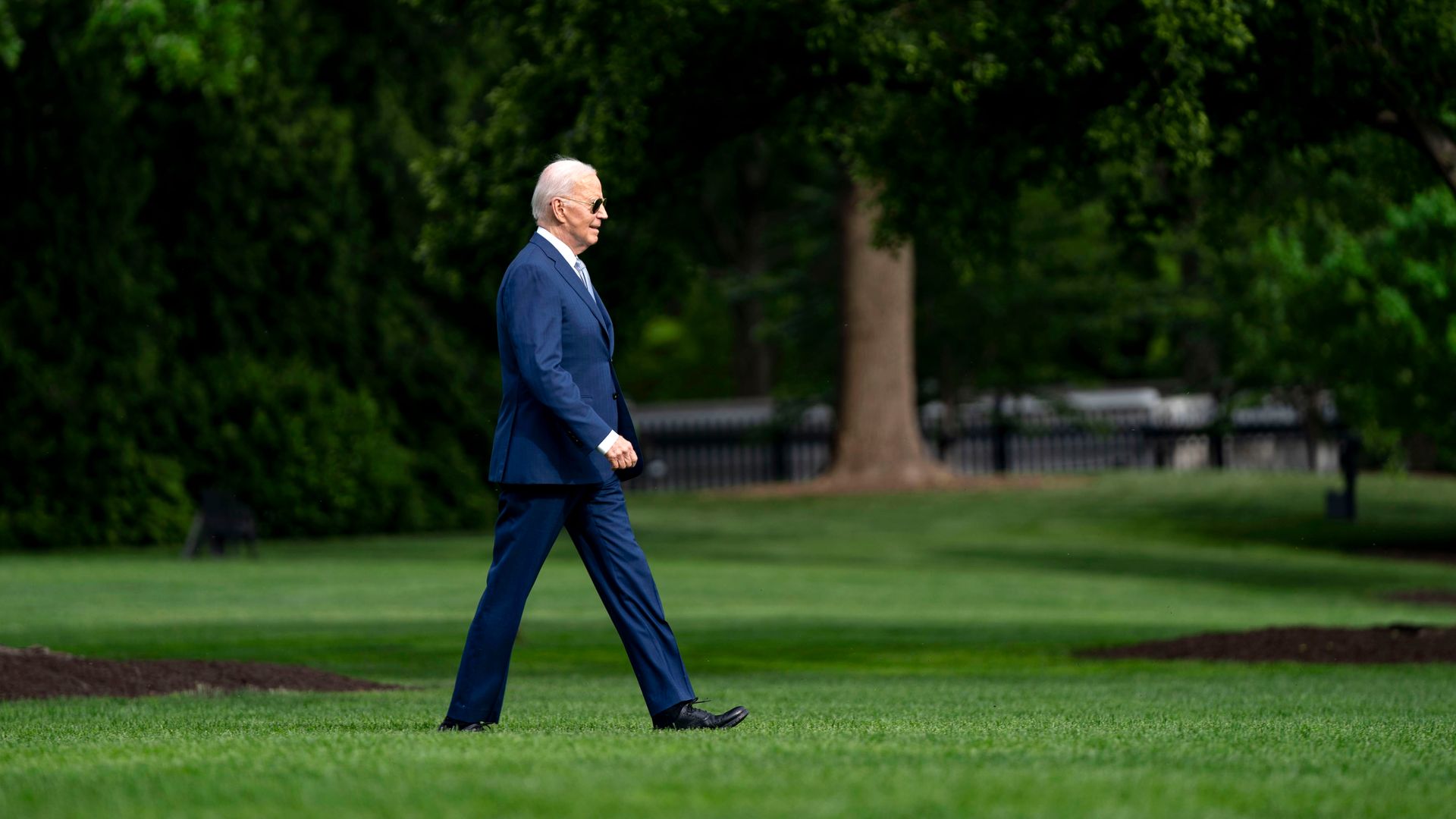 US President Joe Biden walks on the South Lawn of the White House before boarding Marine One in Washington, DC, US