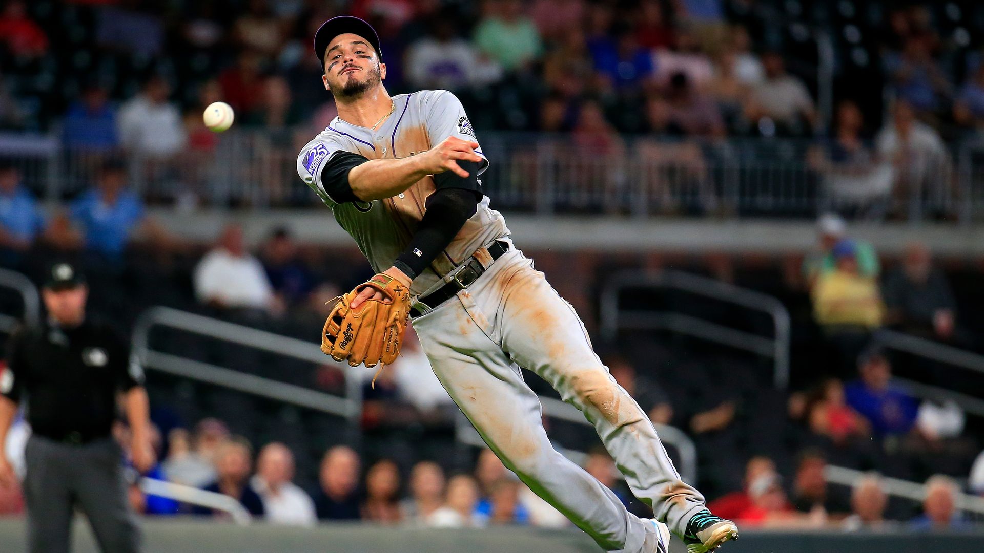 nolan arenado throwing the ball from third