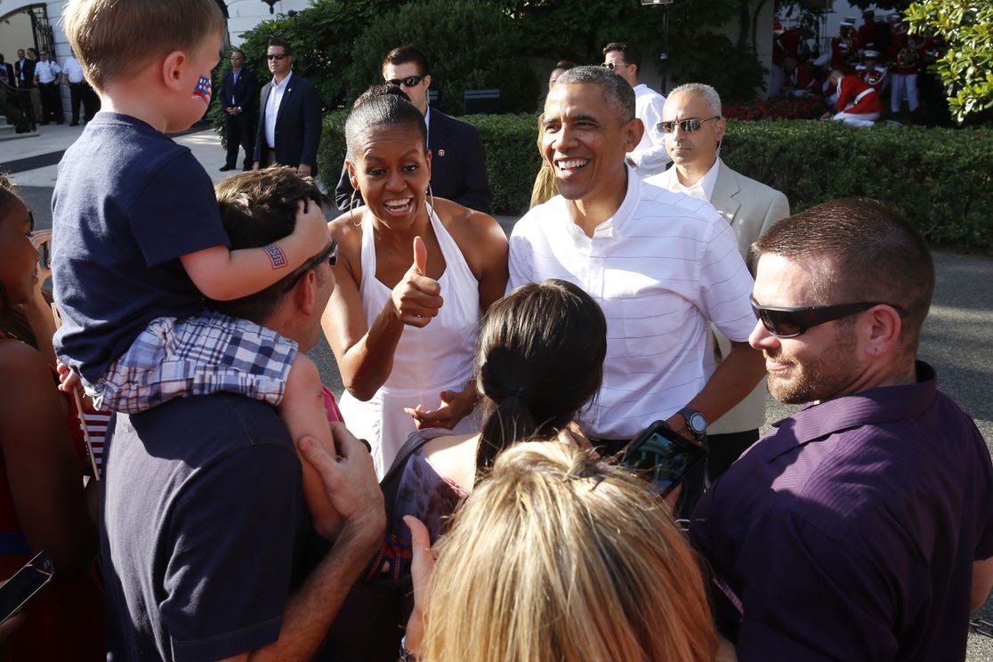 President Obama and the First Lady meeting a group of folks. 