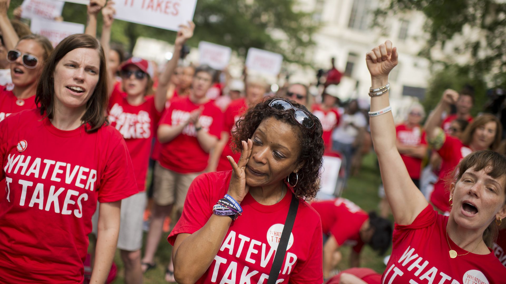 Gun control activists chant at a protest.