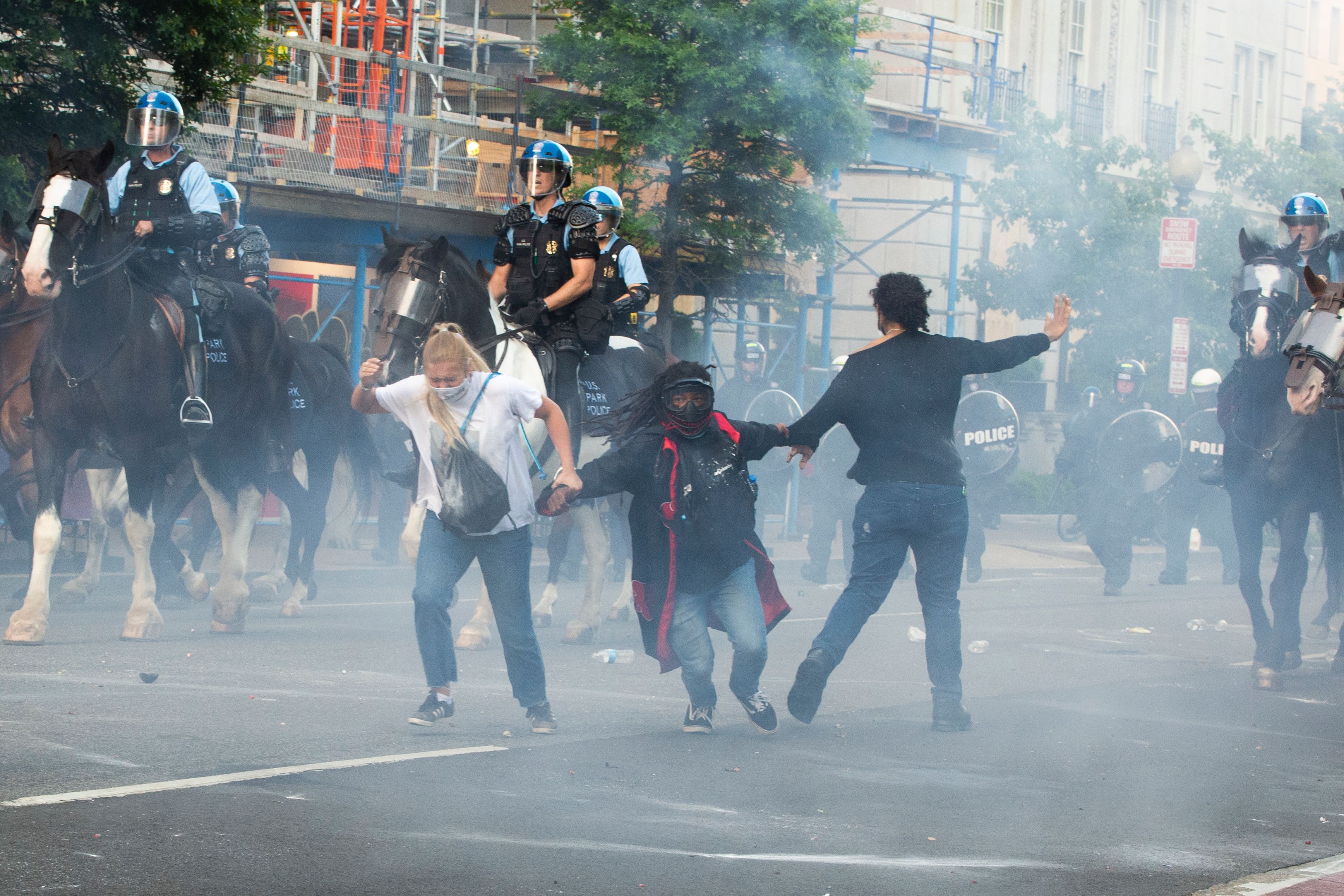Protestors are tear gassed as the police disperse them near the White House on June 1, 2020 as demonstrations against George Floyd's death continue