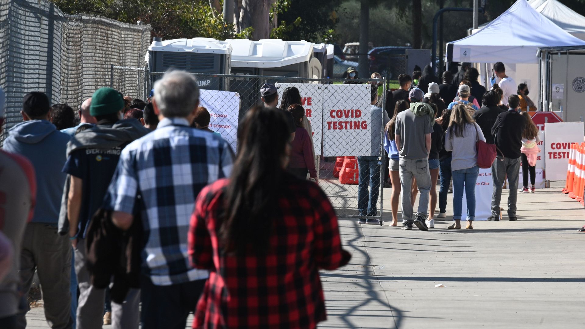 People wait in long lines for coronavius tests at a walk-up Covid-19 testing site, November 24, 2020, in San Fernando, California