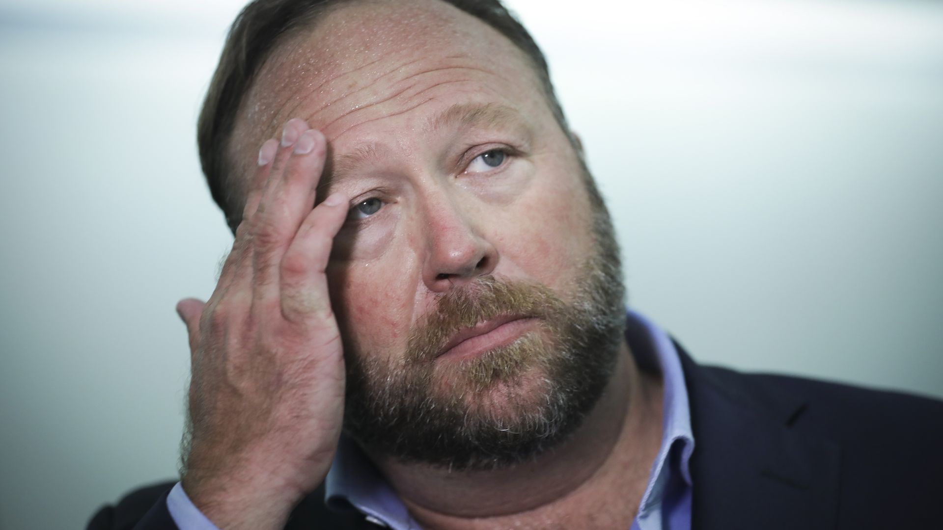 Alex Jones of InfoWars talks to reporters outside a Senate Intelligence Committee hearing concerning foreign influence operations' use of social media platform