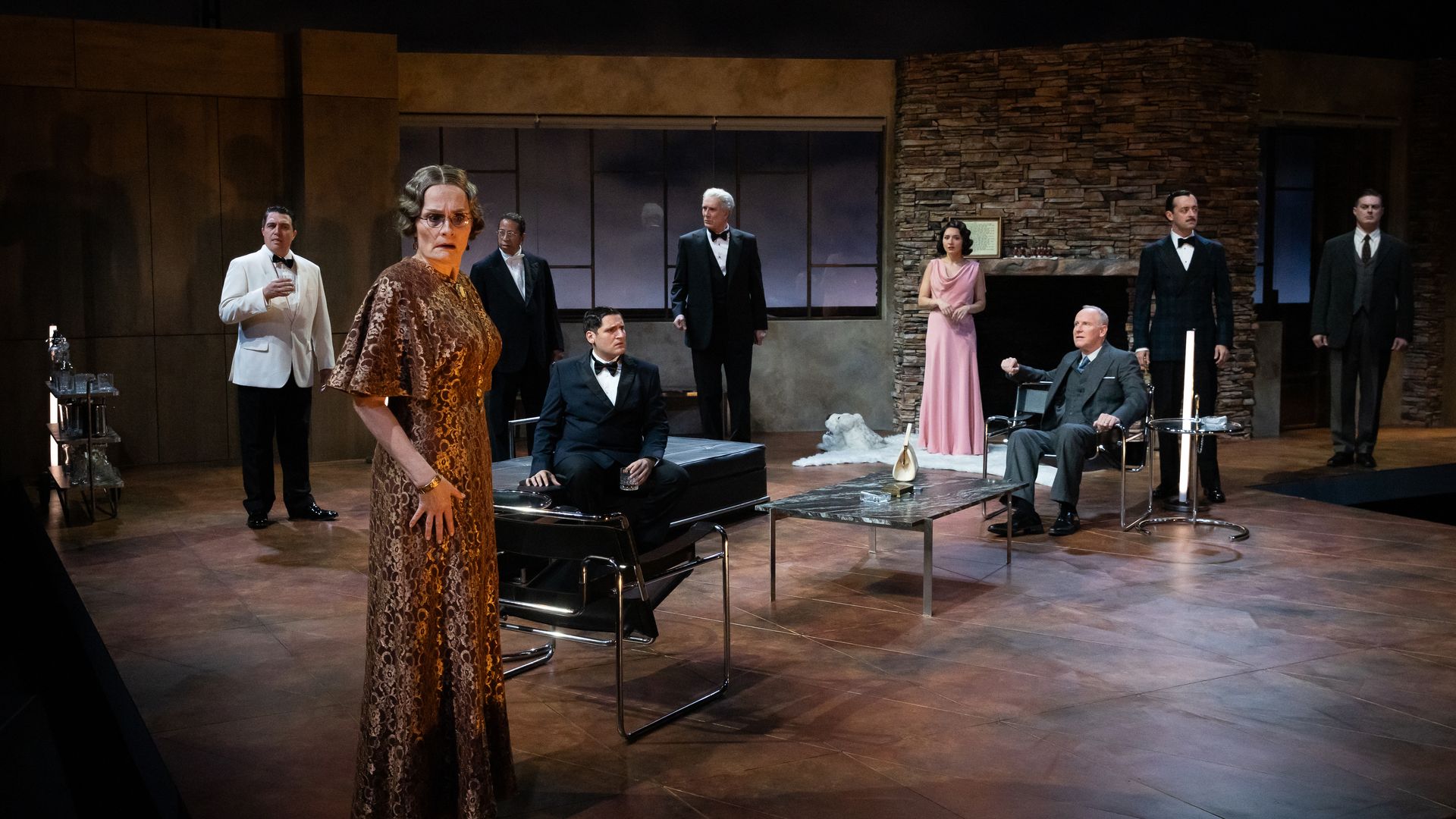 Photo of 9 people on a stage in formal attire