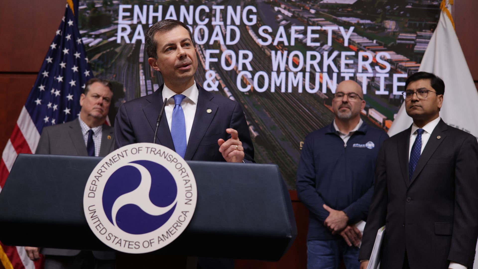 Photo of US DOT Secretary Pete Buttigieg speaking at a podium