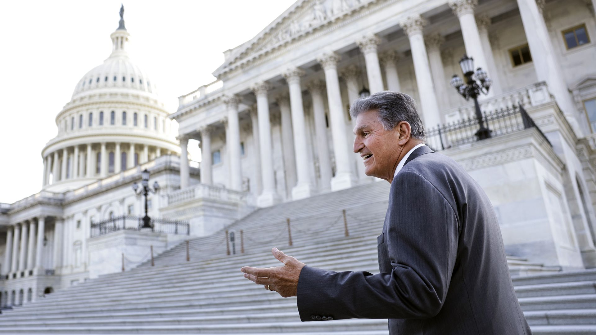 Sen. Joe Manchin is seen walking up the Senate steps at the Capitol on Monday.