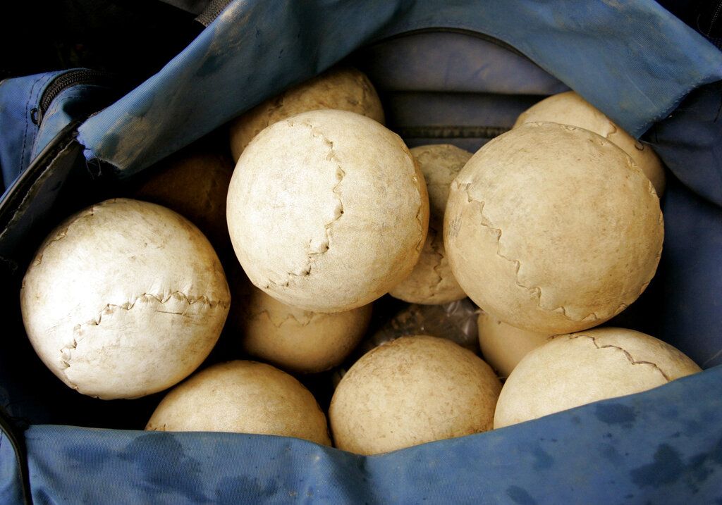 Photo of 16 inch softballs in a bag.