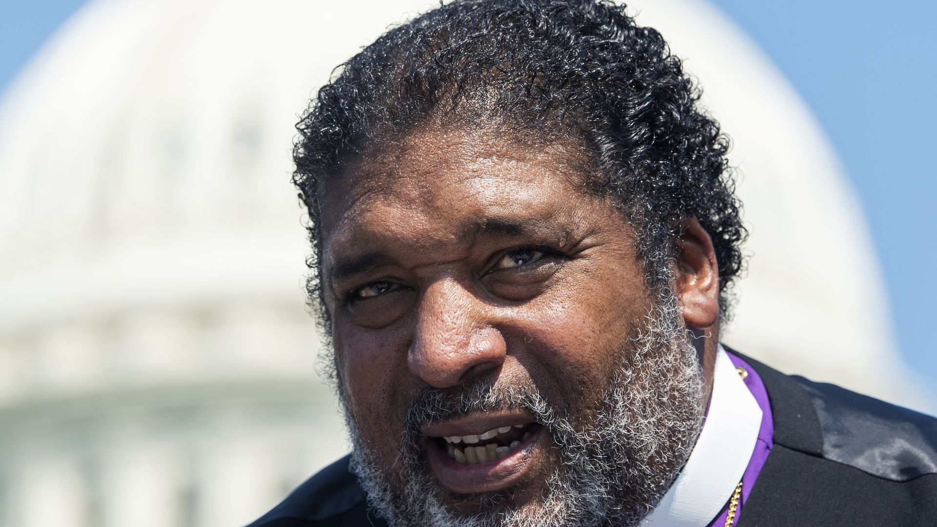 Rev. Dr. William Barber conducts a news conference on voting rights and infrastructure outside the U.S. Capitol.