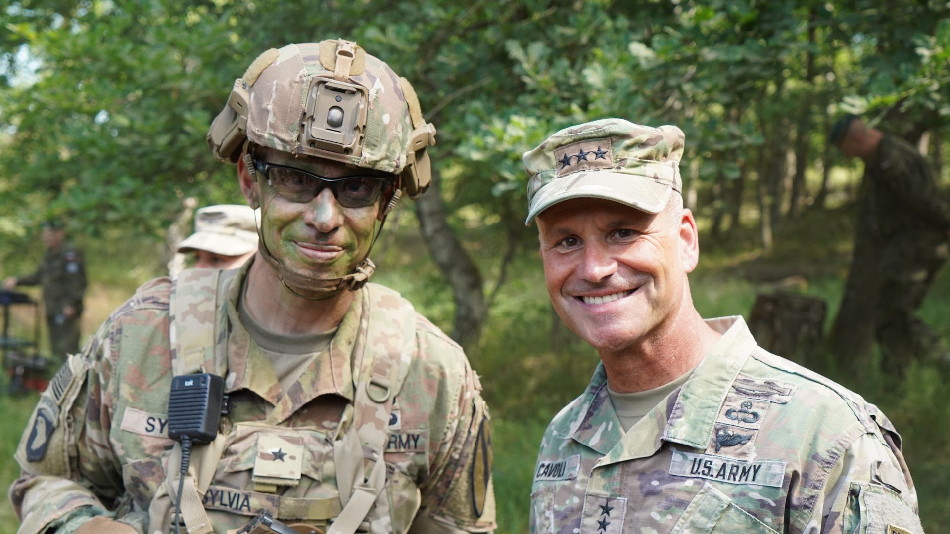 Army Gen. Brett Sylvia is shown at right.