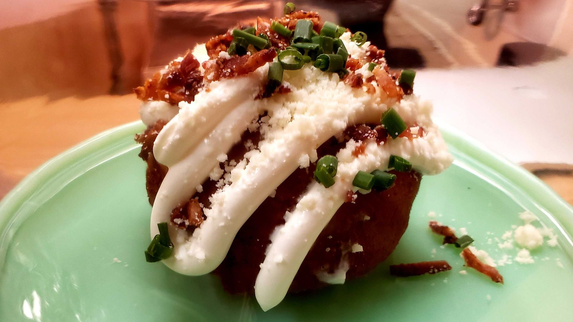 Photo of a potato doghnut on a plate. 