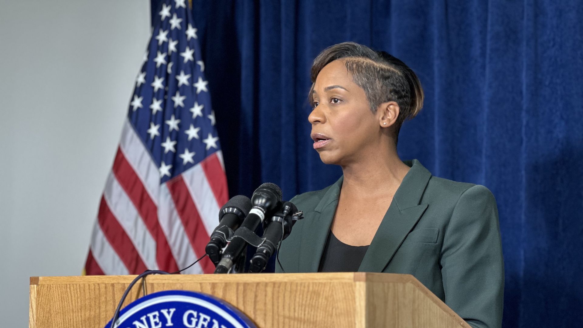 Massachusetts Attorney General Andrea Campbell speaking from a podium