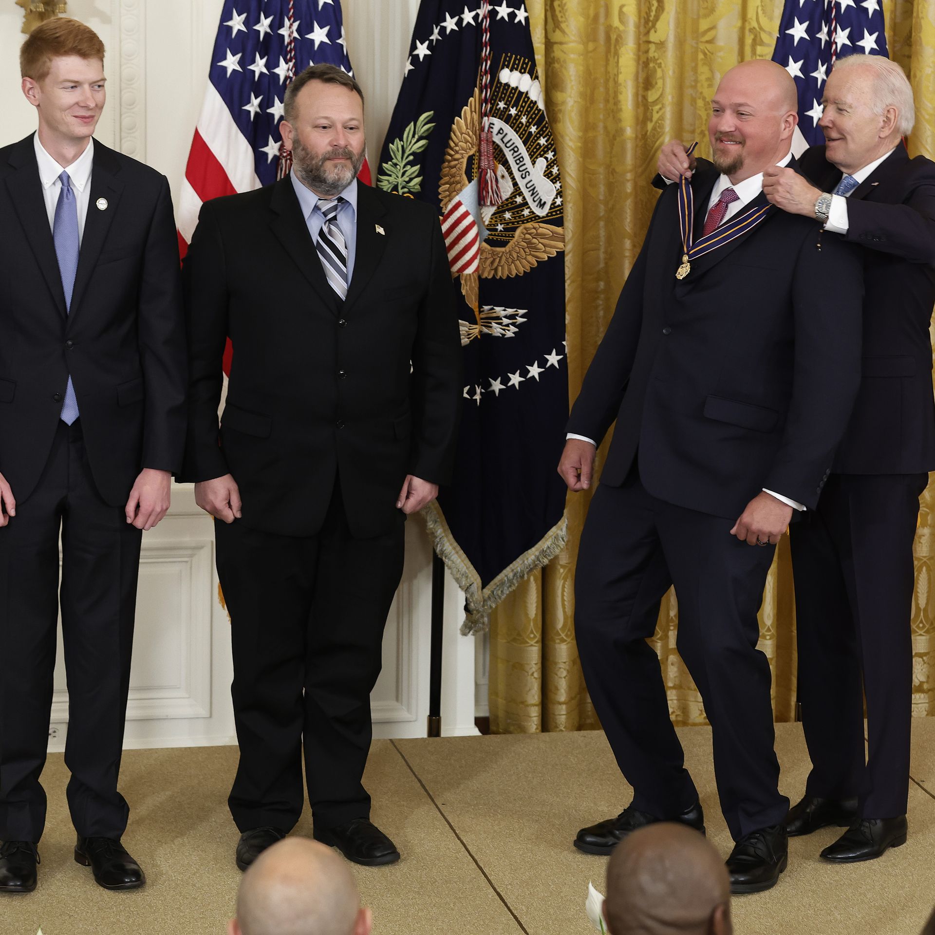 President Biden is seen awarding medals of valor to public safety officials.