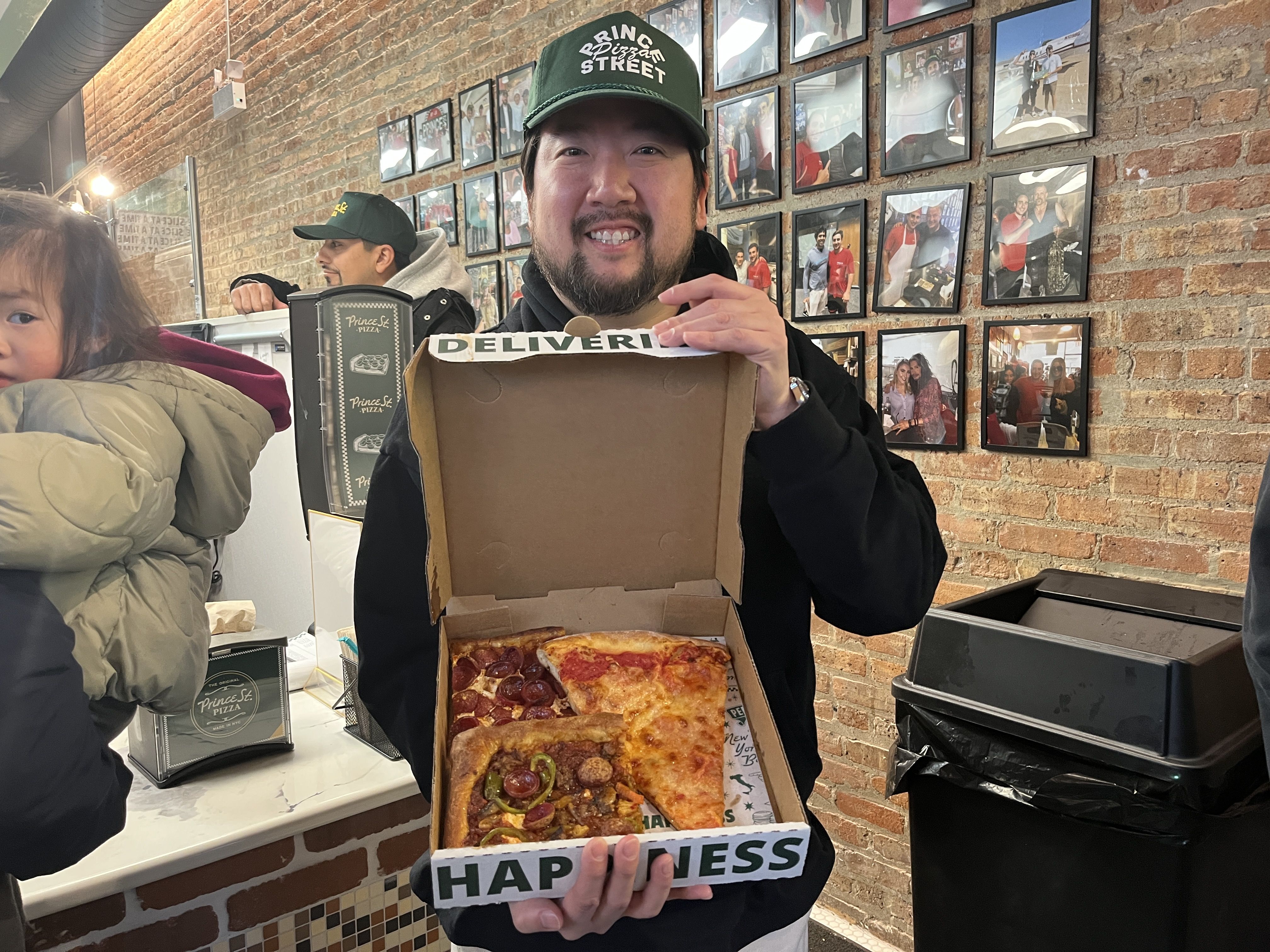 guy with box of pizza