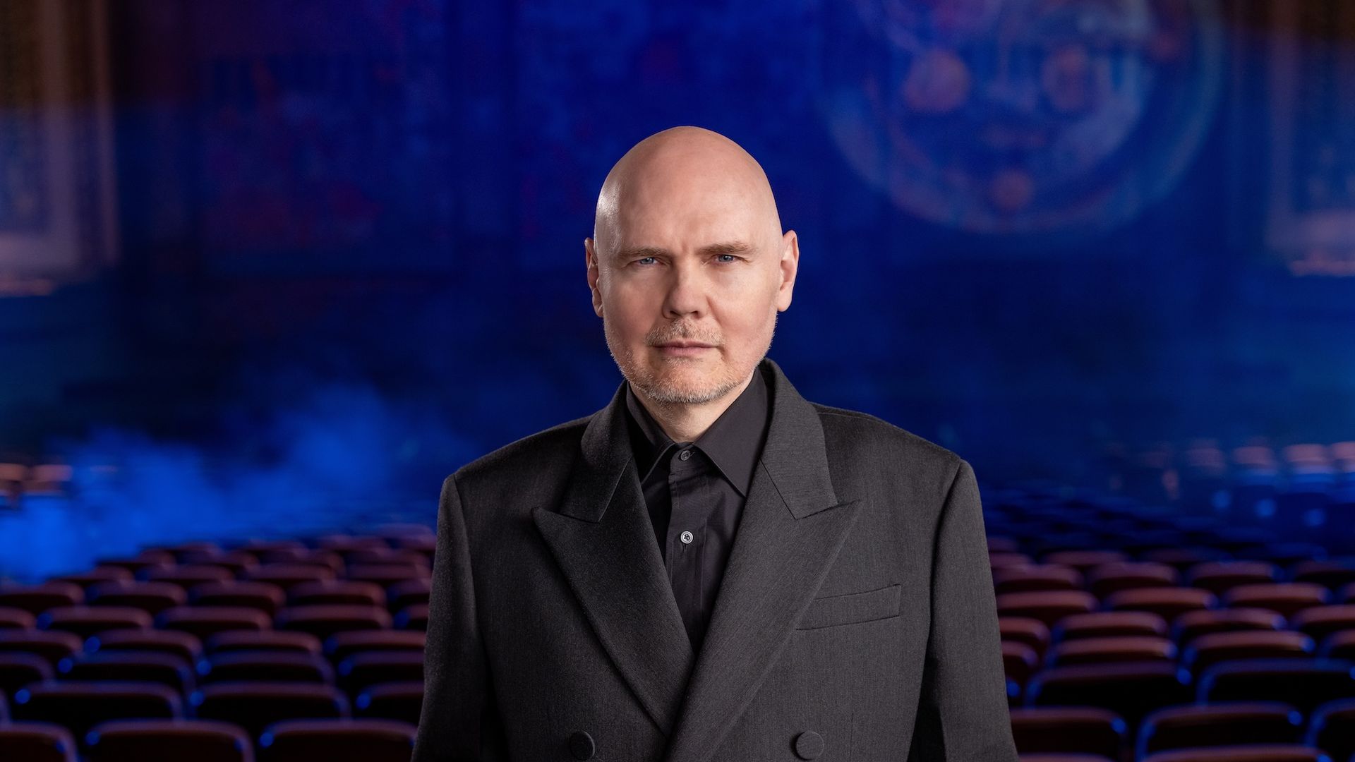 Billy Corgan standing in front of the seats at Lyric Opera.