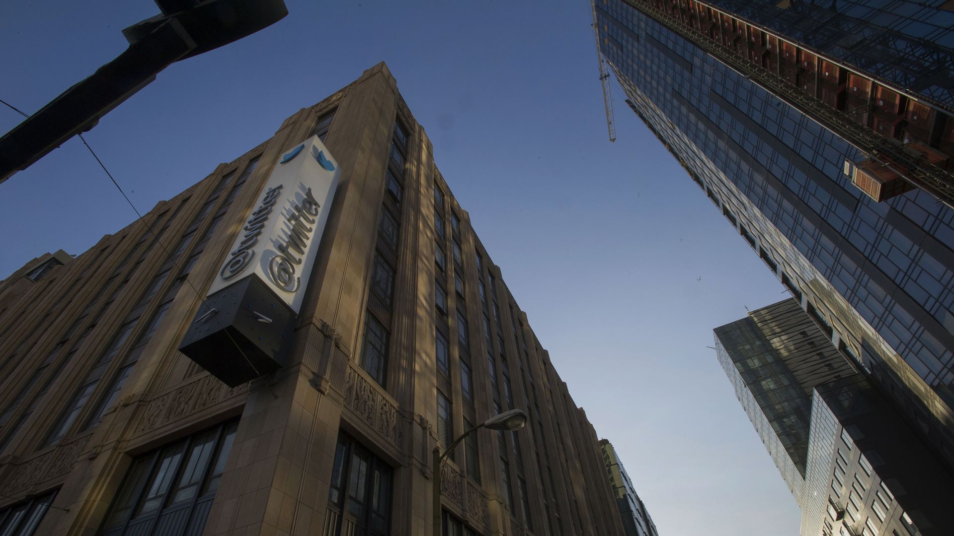 Photo of the Twitter headquarters and the "@twitter" signage hanging from the side
