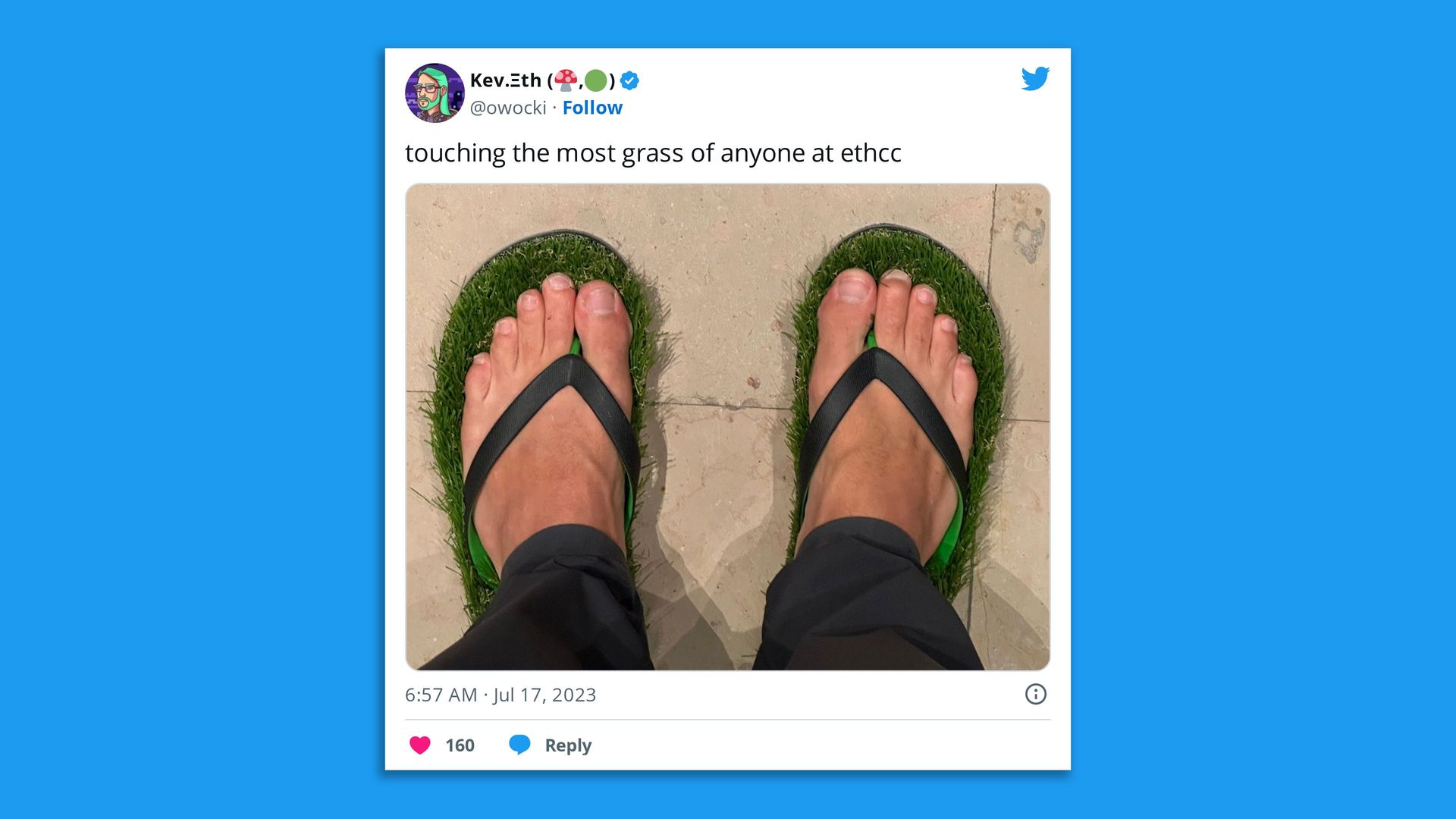 A man's feet in flip flops lined with grass.
