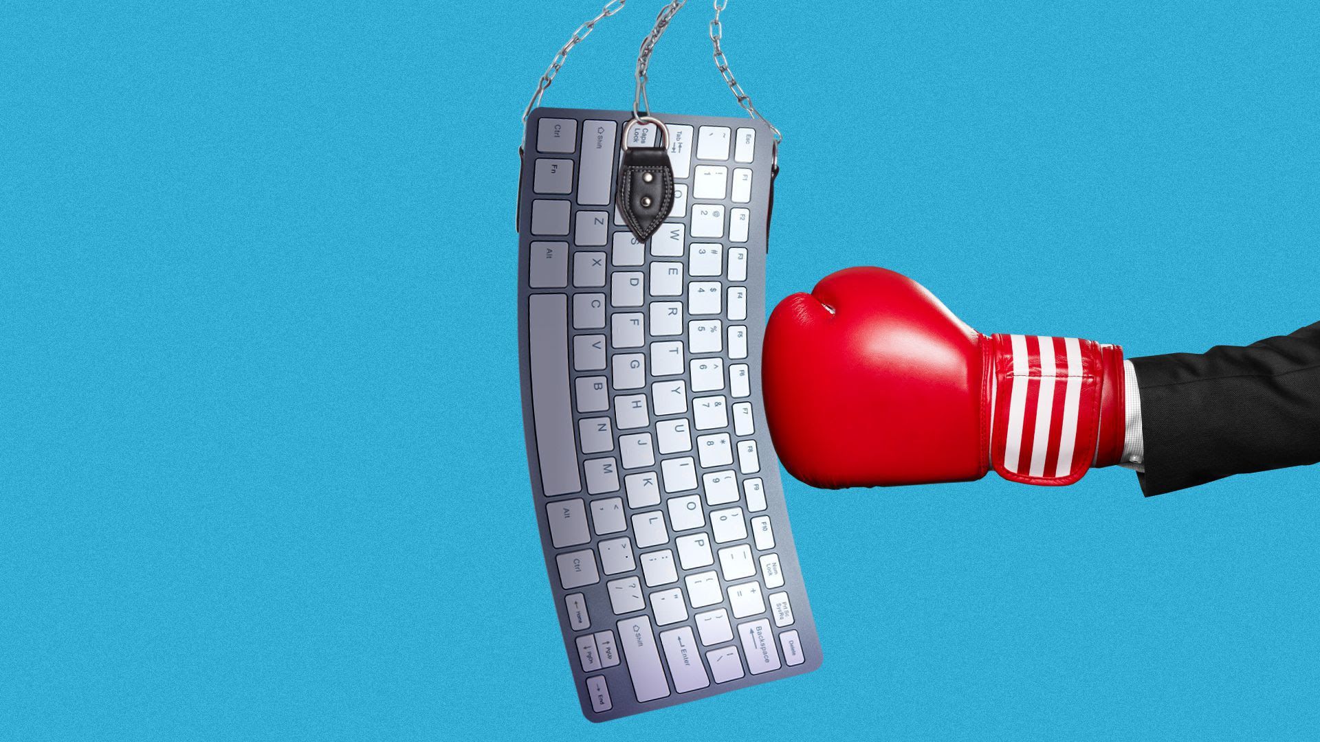a boxing glove punching a keyboard