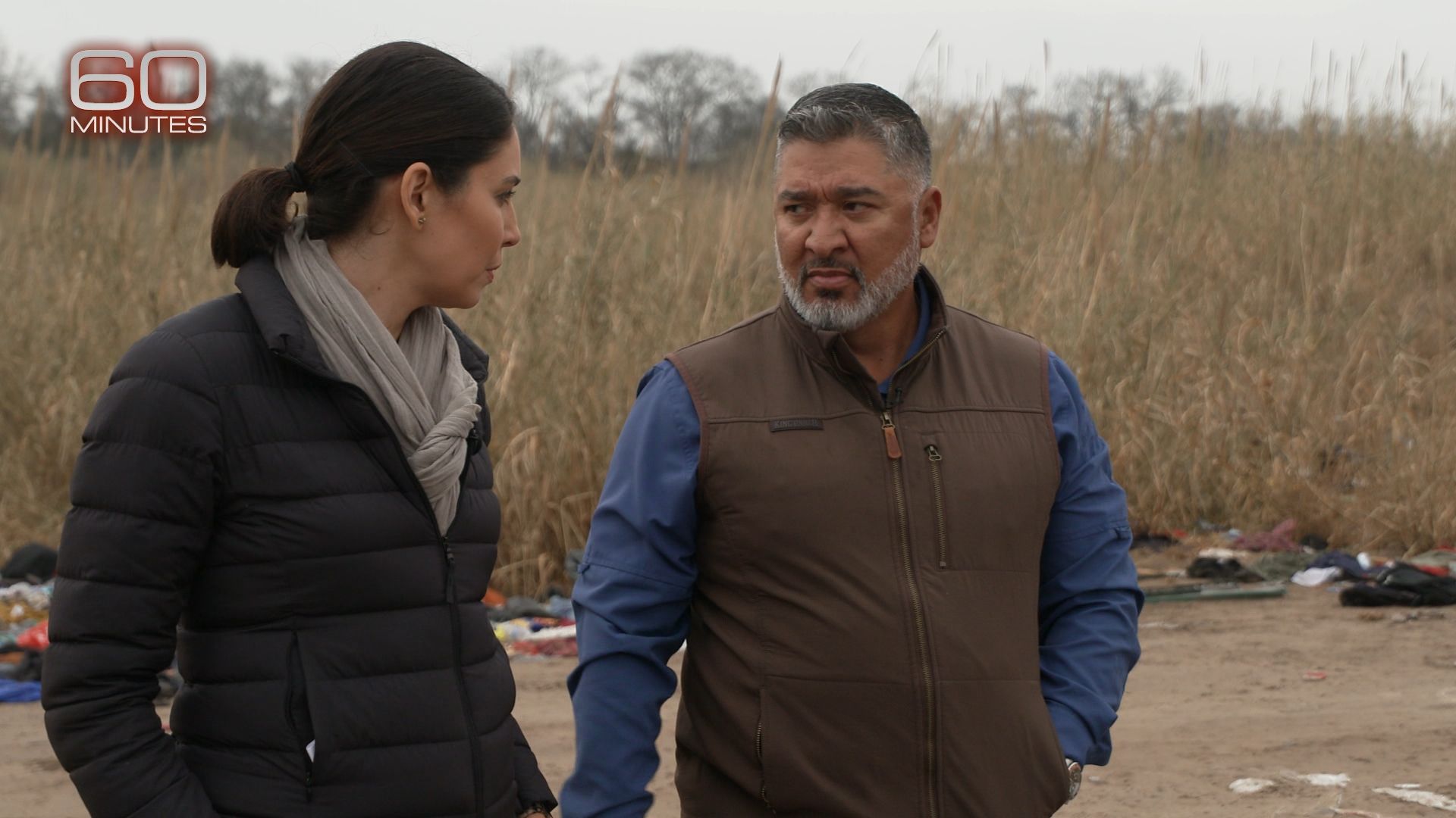 CBS' Cecilia Vega and former U.S. Border Patrol Chief Raul Ortiz speaking at the U.S.-Mexico border for an episode of "60 Minutes."