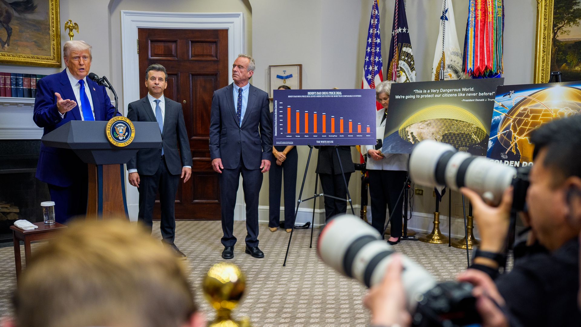 U.S. President Donald Trump (L), accompanied by Food and Drug Administration (FDA) Commissioner Martin Makary (2nd-L), and Health and Human Services Secretary Robert F. Kennedy Jr. (C), speaks during a press conference in the Roosevelt Room of the White House on May 12.
