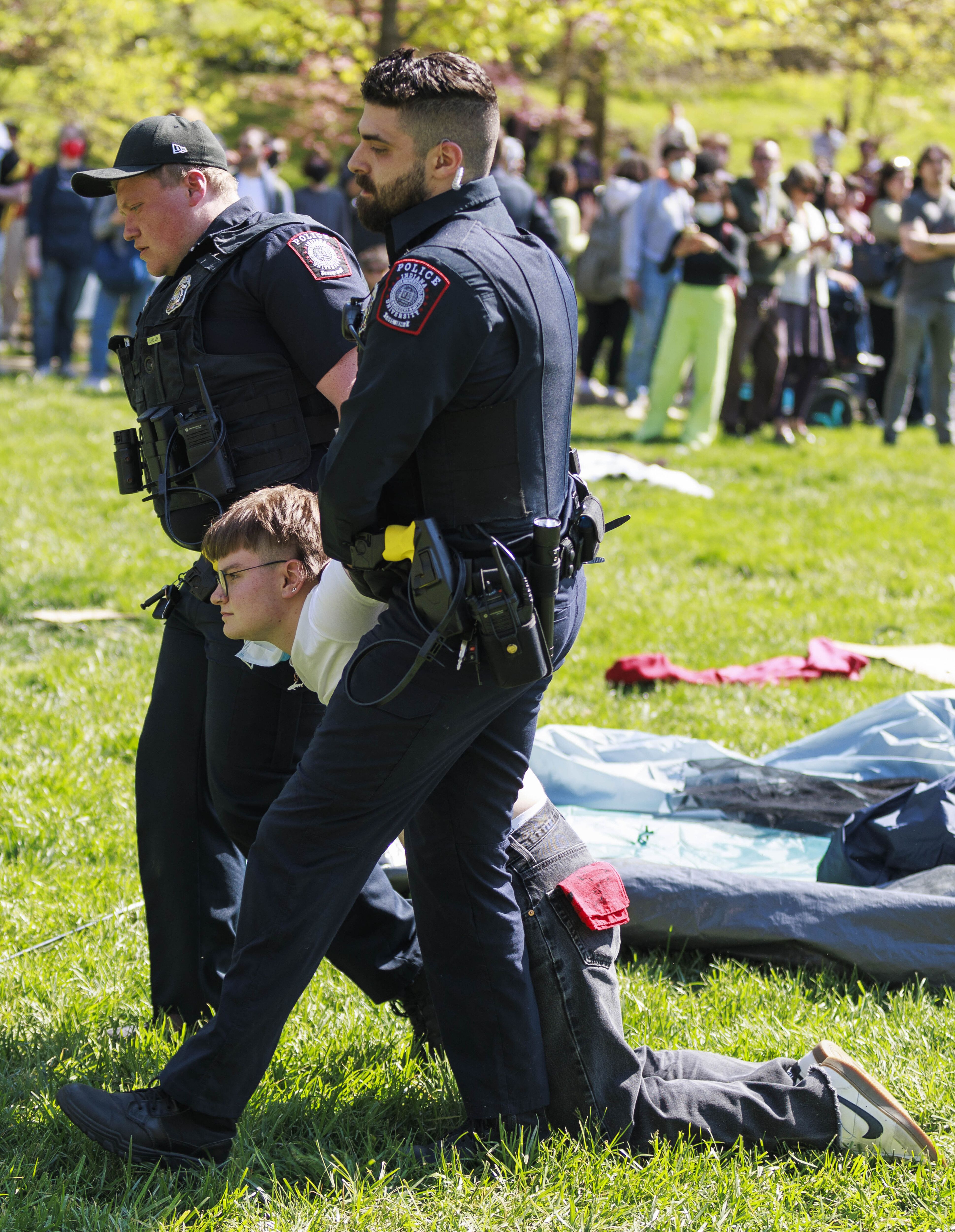 A police officer arresting protestors