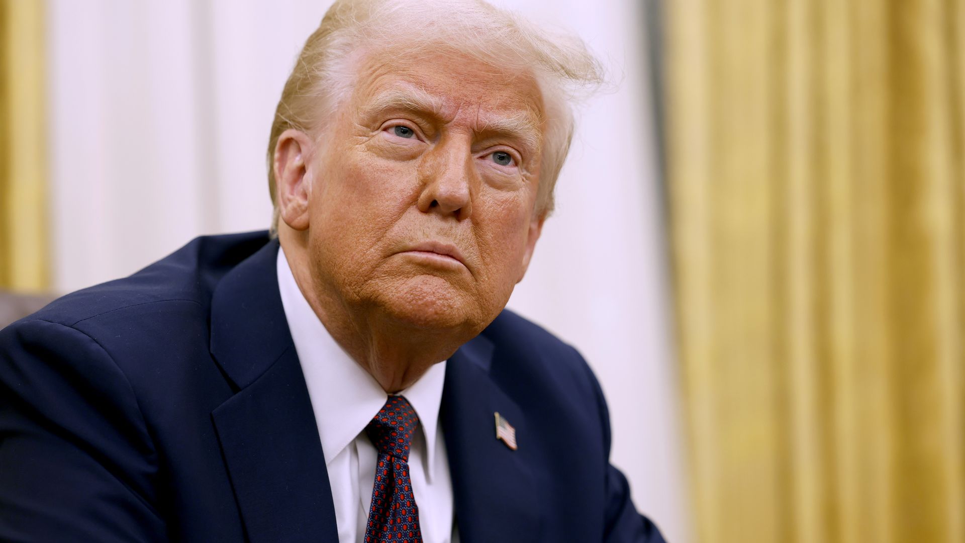 President Donald Trump speaks to reporters after signing a series of executive orders in the Oval Office of the White House on January 23, 2025 in Washington, DC. Trump signed a range of executive orders pertaining to issues including crypto currency, Artificial Intelligence, and clemency for anti-a