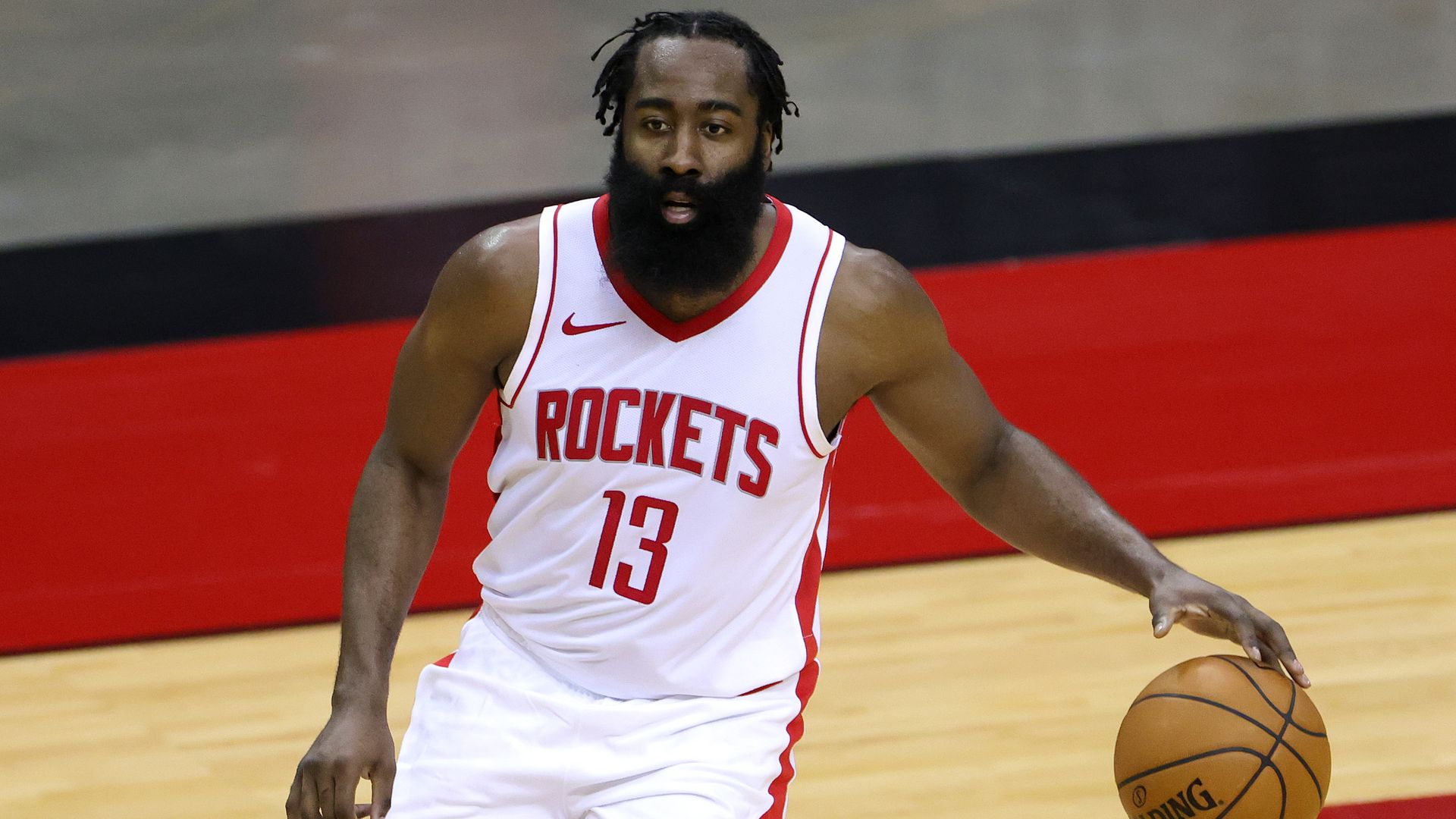 James Harden #13 of the Houston Rockets controls the ball during the first half of a game against the San Antonio Spurs at the Toyota Center on December 17, 2020 in Houston, Texas