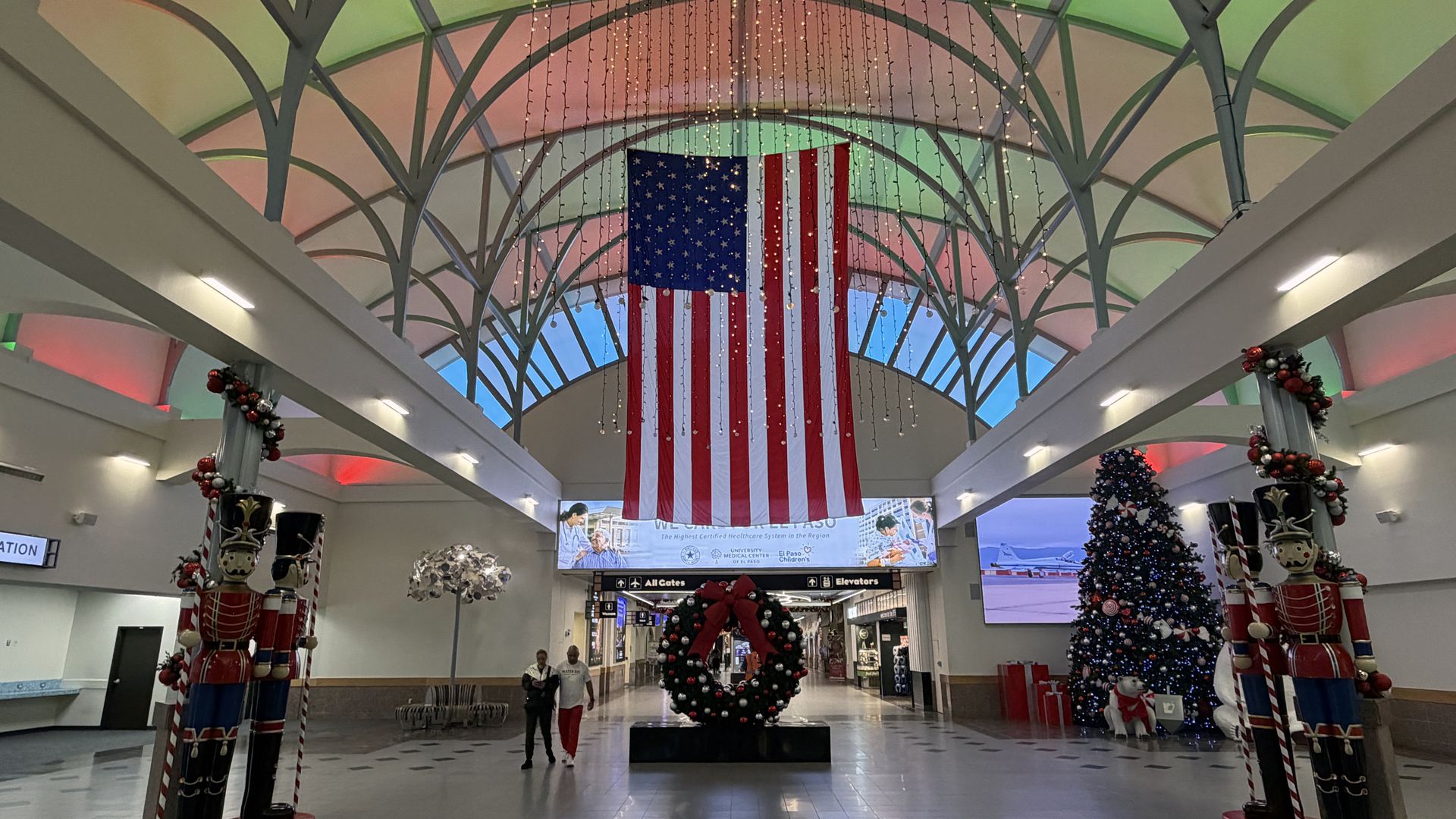 EL PASO, TEXAS - DECEMBER 25: A United States flag and Christmas decorations at the El Paso International Airport (ELP) on December 25, 2025 in El Paso, Texas. (Photo by Kirby Lee/Getty Images)
