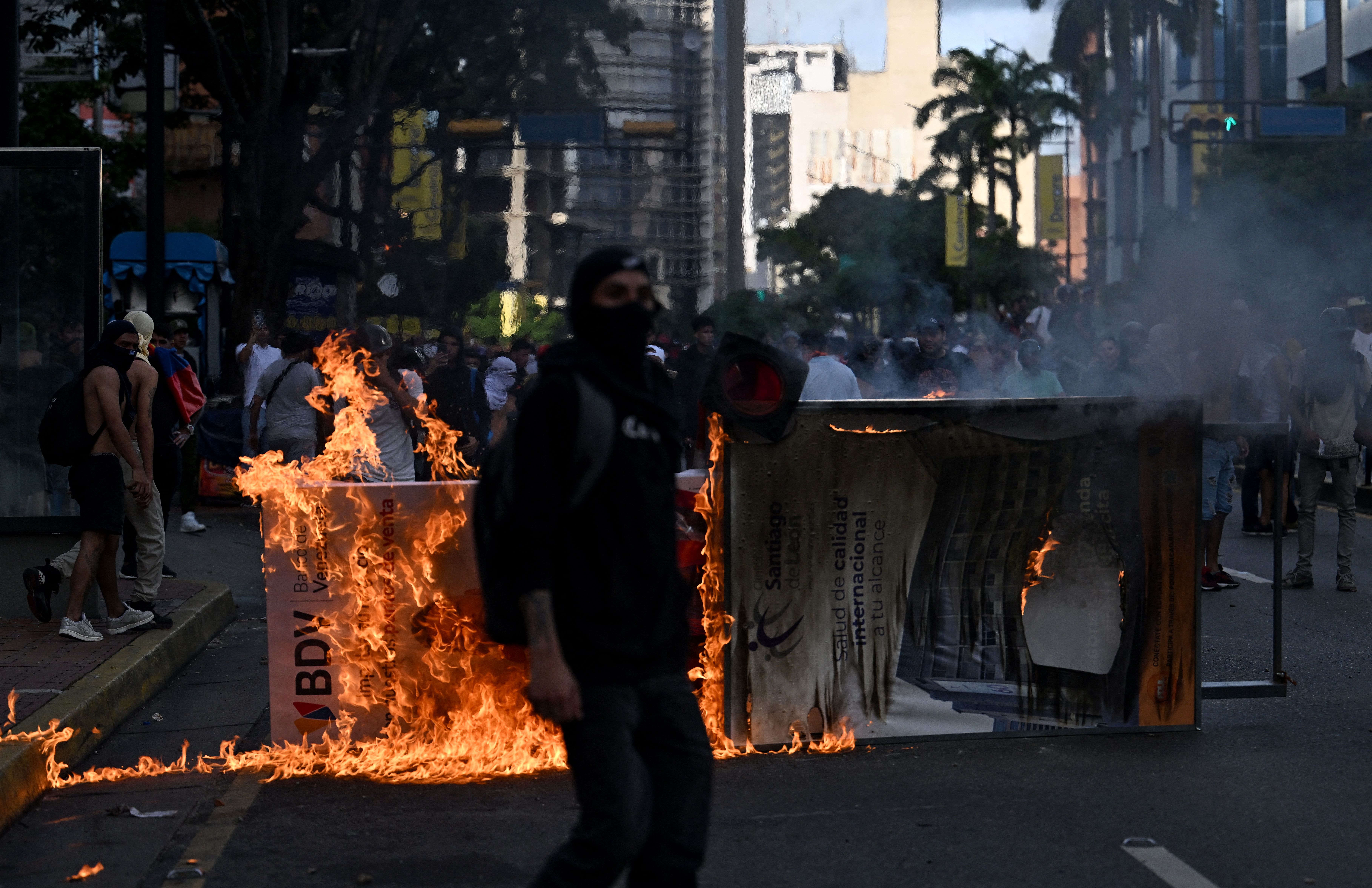 Demonstrators set a barricade on fire during a protest against Venezuelan President Nicolas Maduro's government in Caracas on July 29.