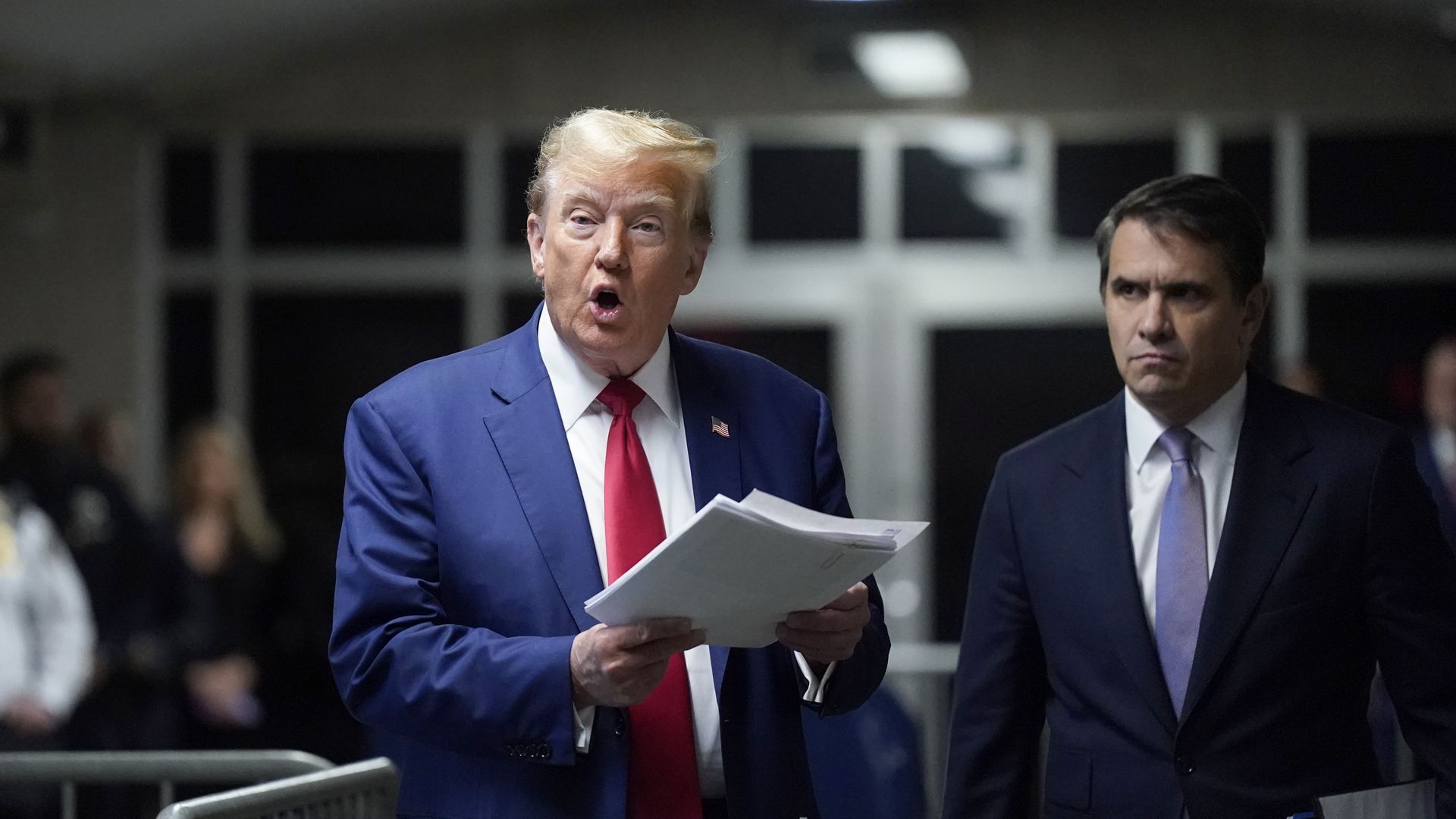 Donald Trump, with attorney Todd Blanche (R), speaks to the press as he arrives for his criminal trial for allegedly covering up hush money payments at Manhattan Criminal Court on May 10,