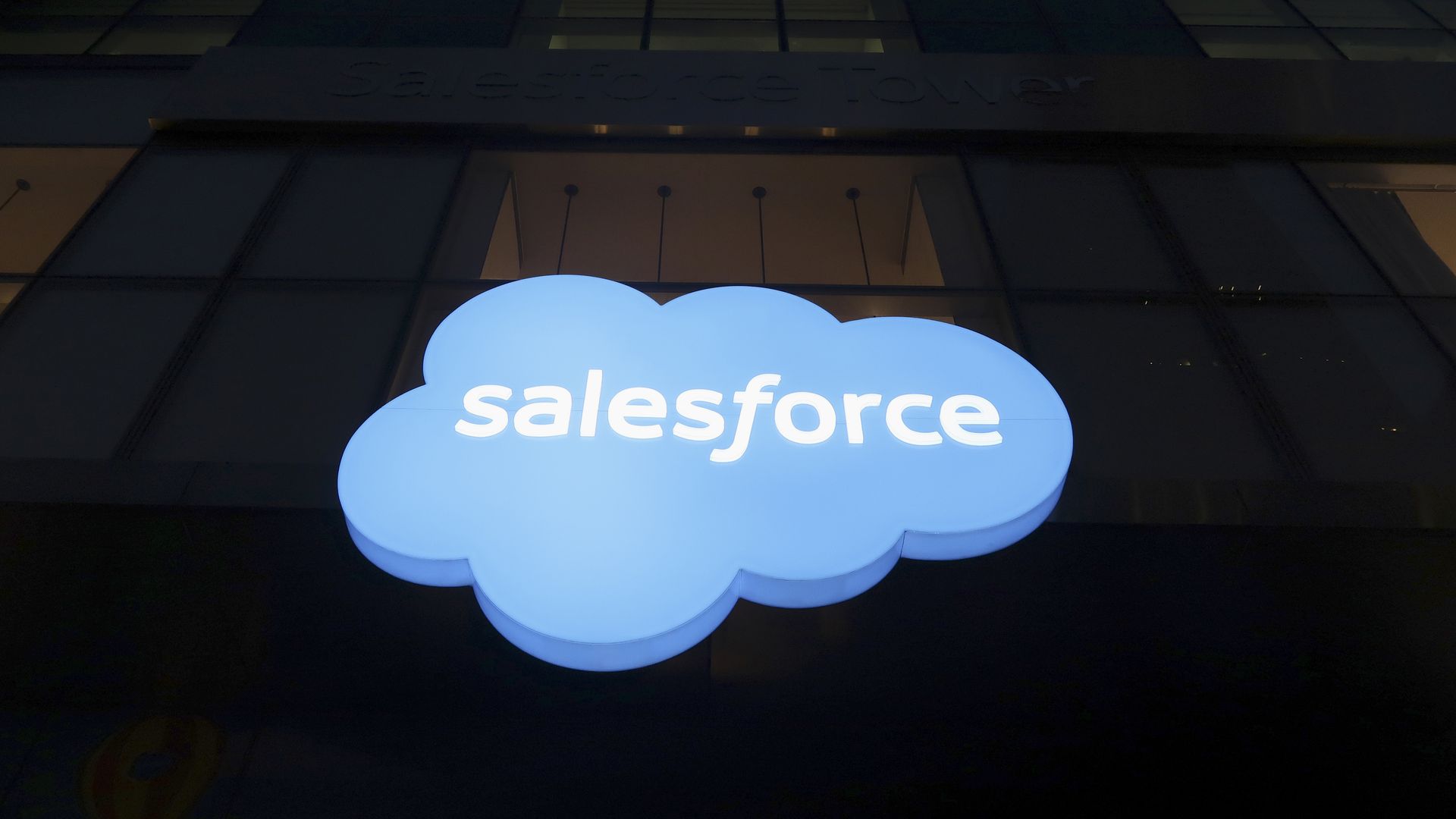 Photo of Salesforce logo on side of a dark building