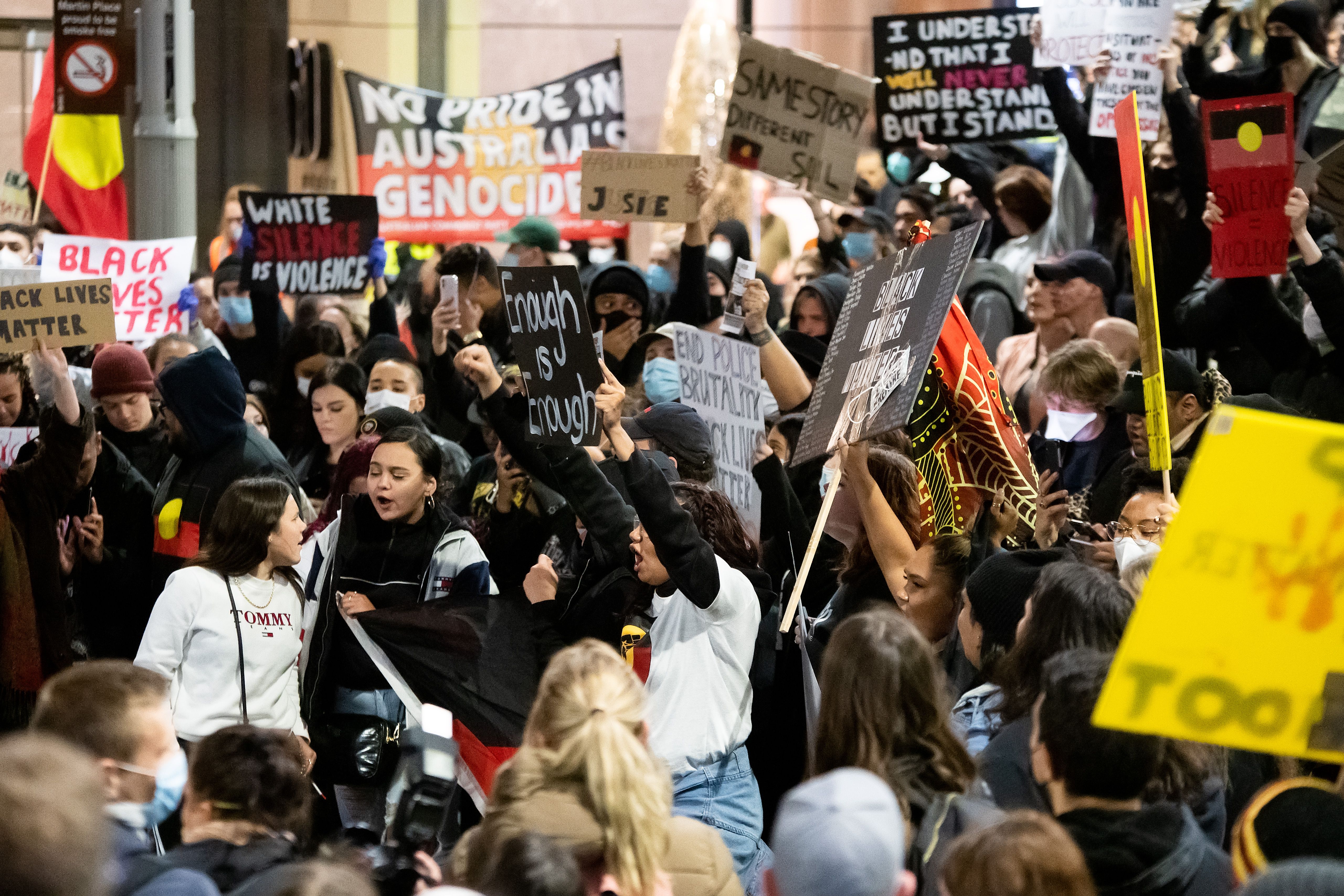 Protesters shout slogans and hold up signs at Martin Place during a 'Black Lives Matter' rally on 02 June, 2020 in Sydney, Australia. 
