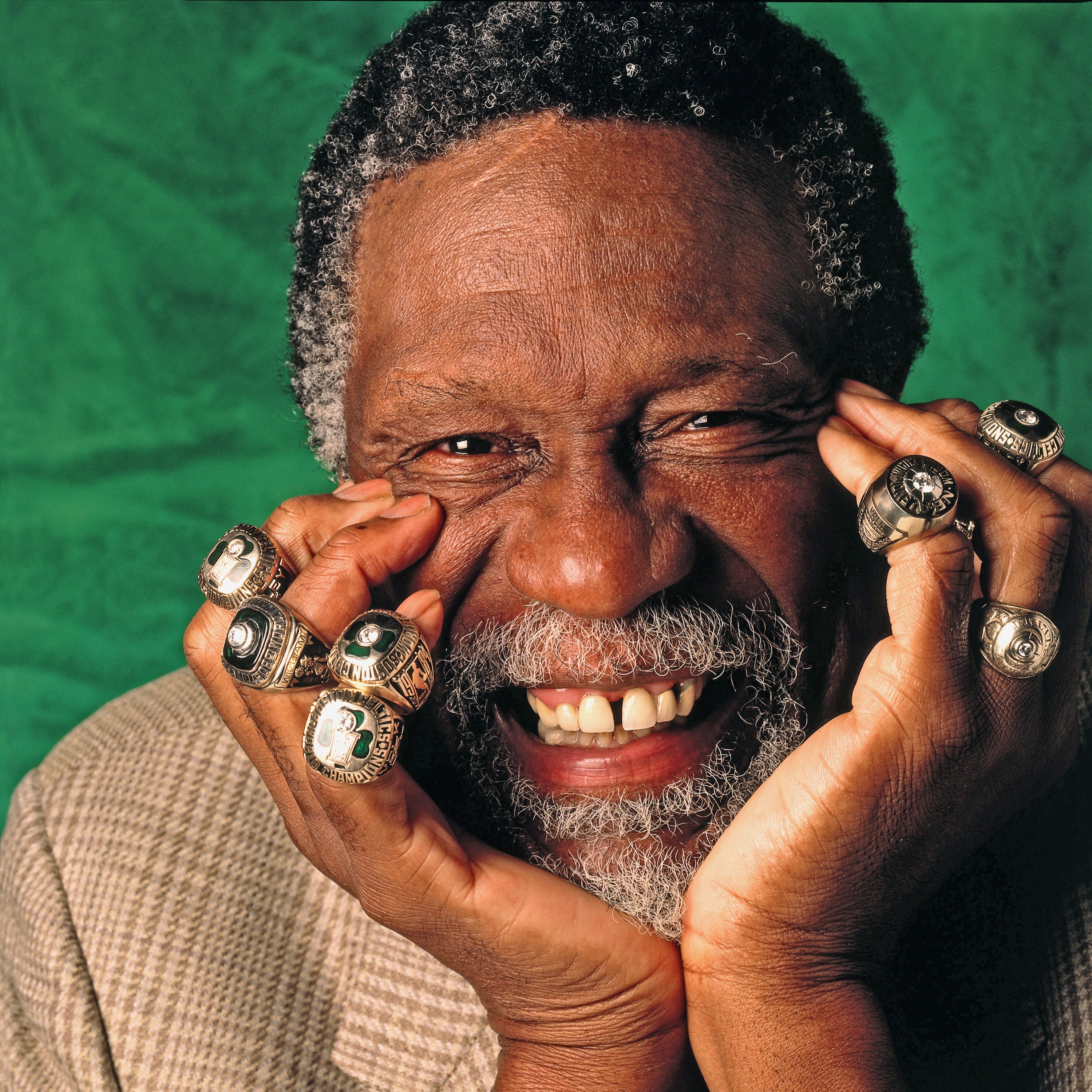 Bill Russell posing with his NBA-Record 11 rings.