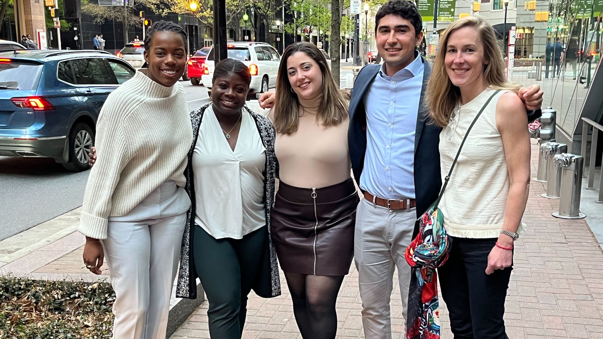 A picture of Paige, Kayla, Chelsea, Cuneyt, and Kristen on a sidewalk in Charlotte