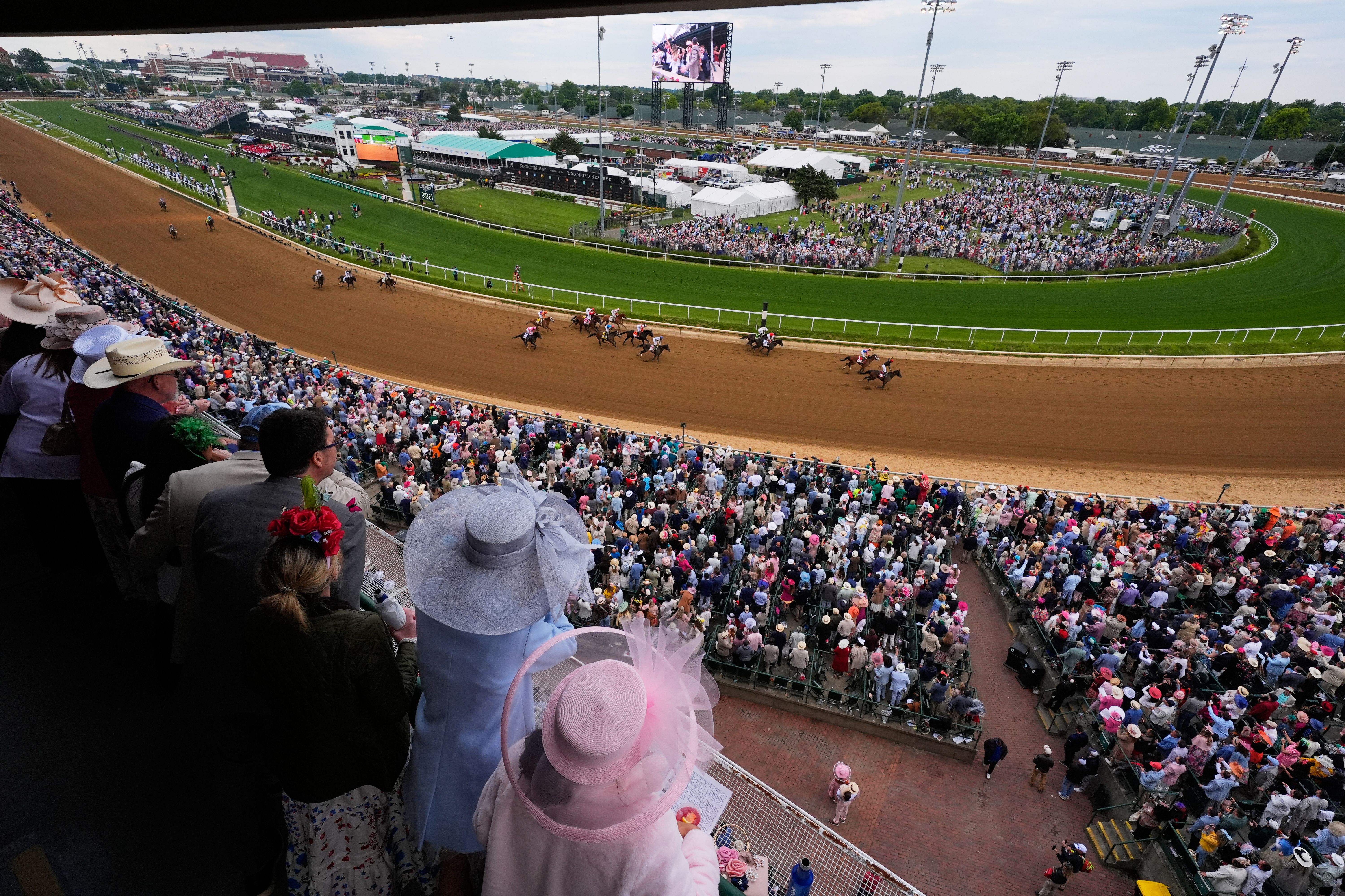 Fans watch as Golden Tempo wins the Kentucky Derby at Churchill Downs on Saturday. 