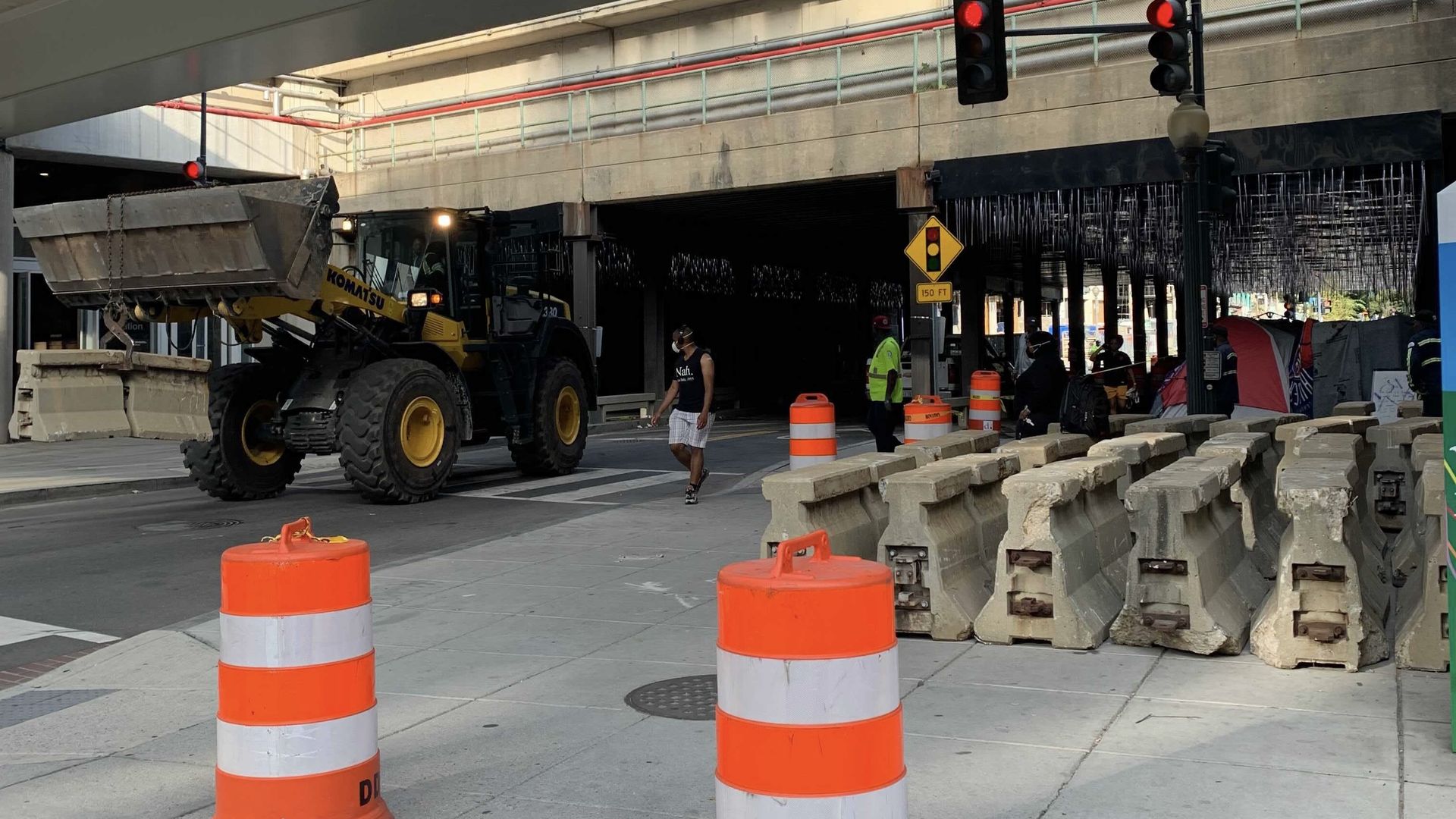 The M Street underpass with construction materials last month when the city first started clearing it.