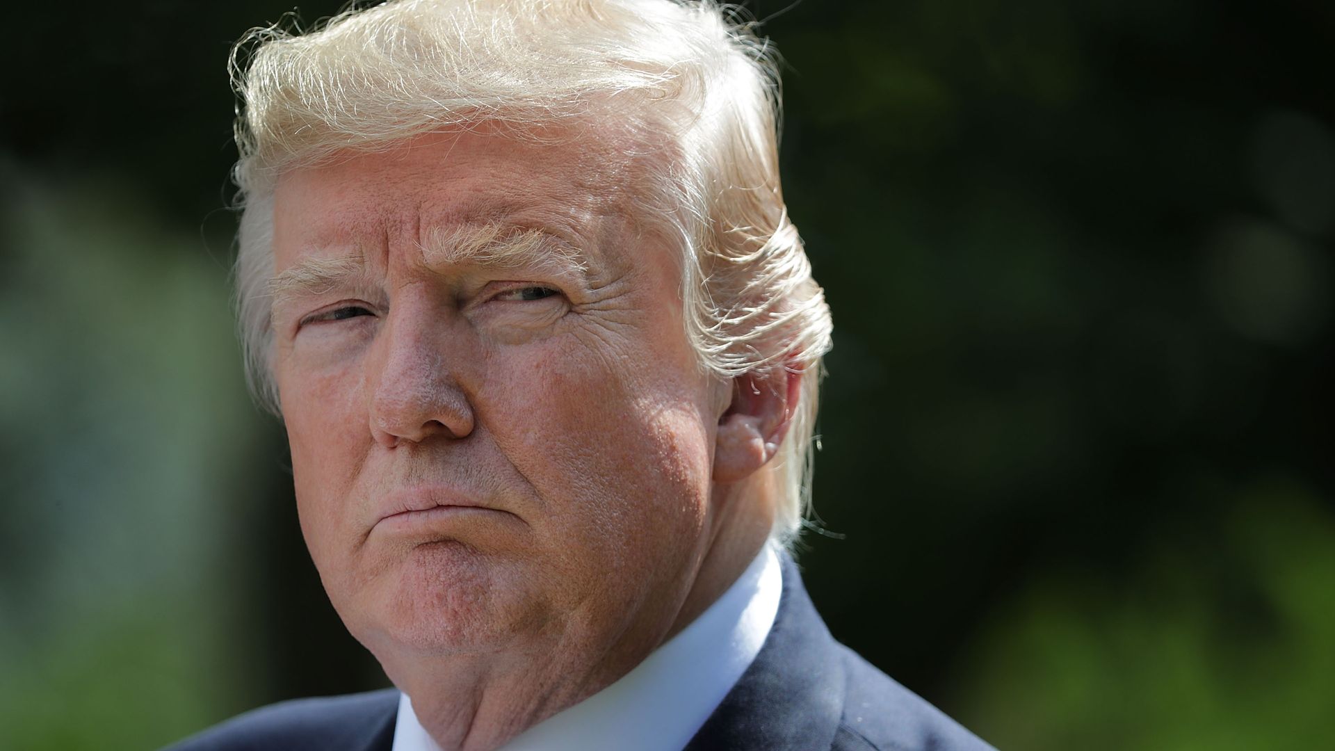 President Trump looks into the distance.