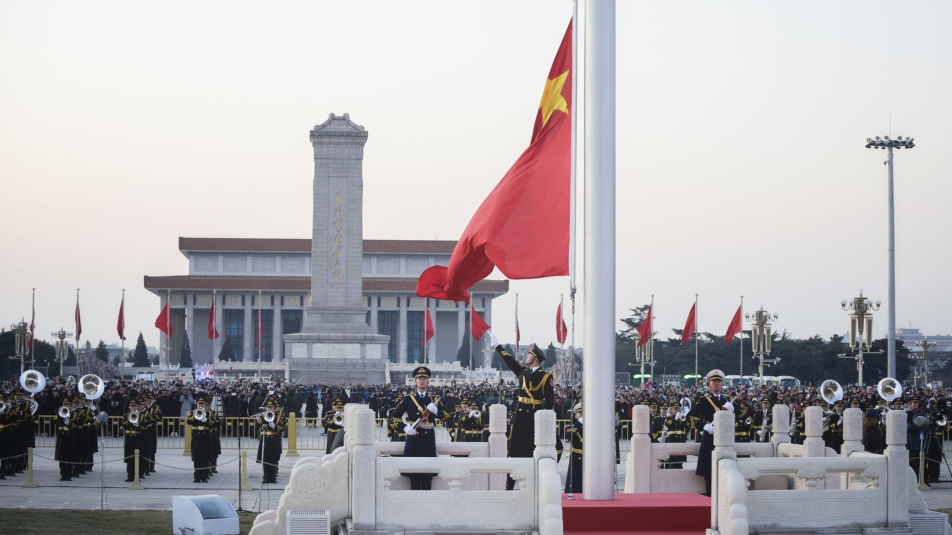 A flag is raised at Tian'anmen Square in Beijing