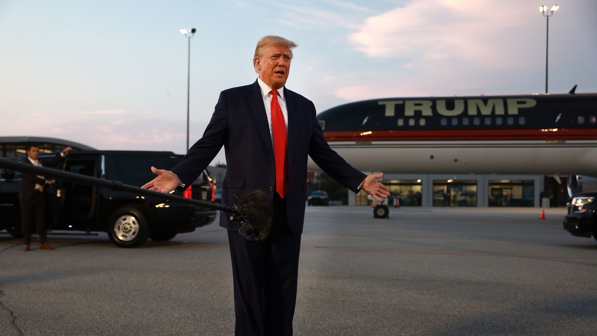 Former U.S. President Donald Trump speaks to the media at Atlanta Hartsfield-Jackson International Airport after being booked at the Fulton County jail on August 24, 2023 in Atlanta, Georgia