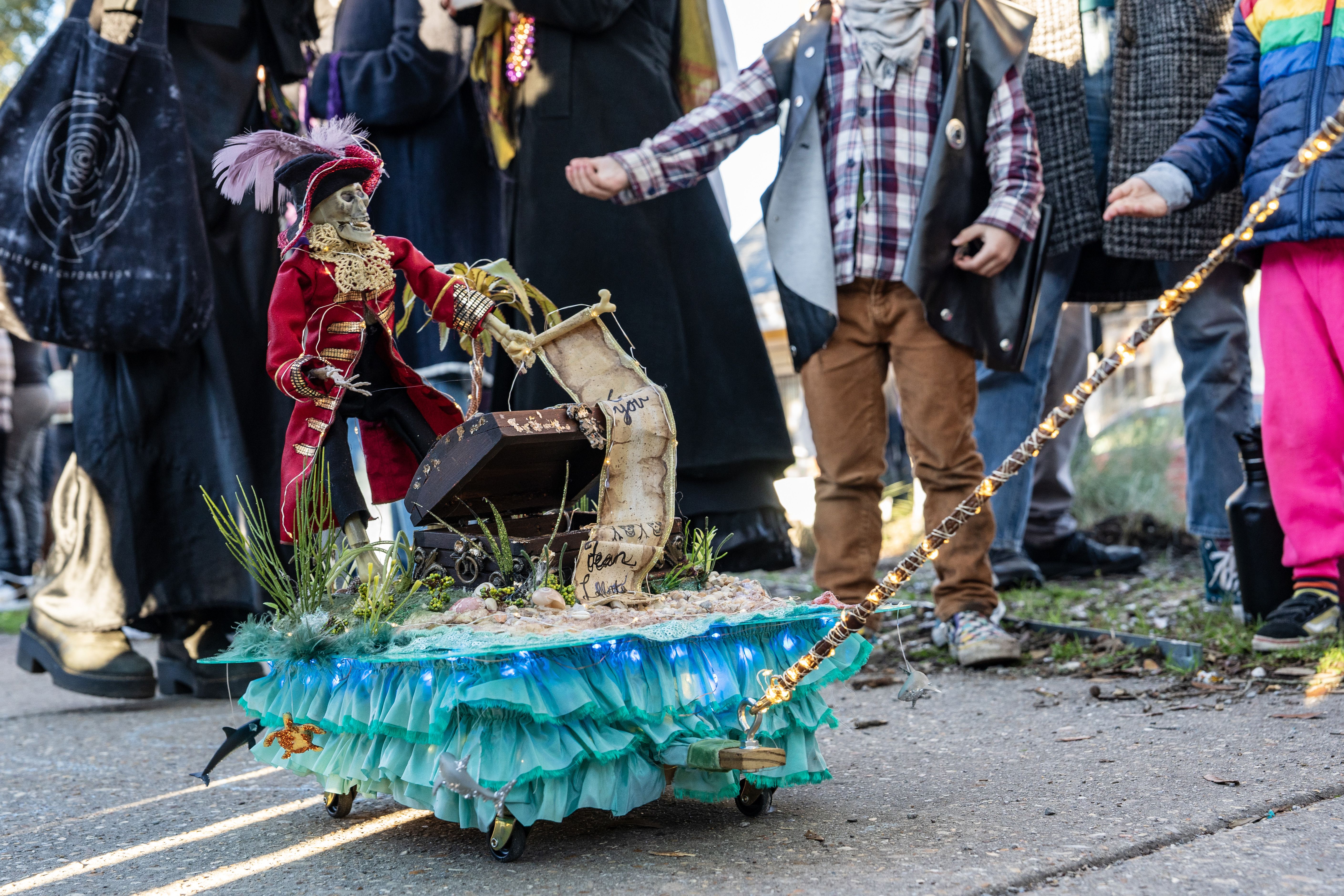 Photo shows a skeleton on a mini float