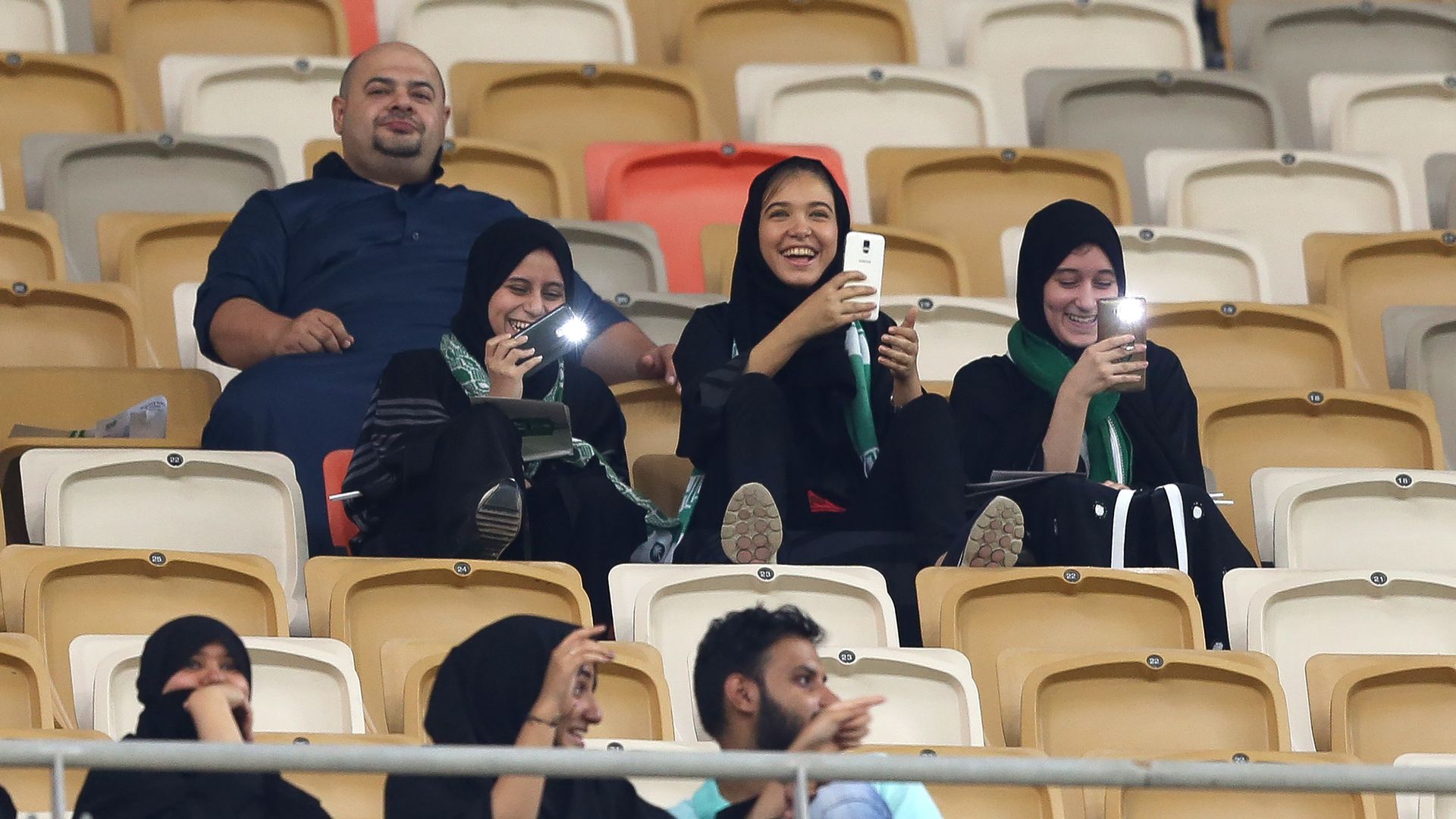 Female Saudi supporters attend their teams football match in the Saudi Pro League at the King Abdullah Sports City. 