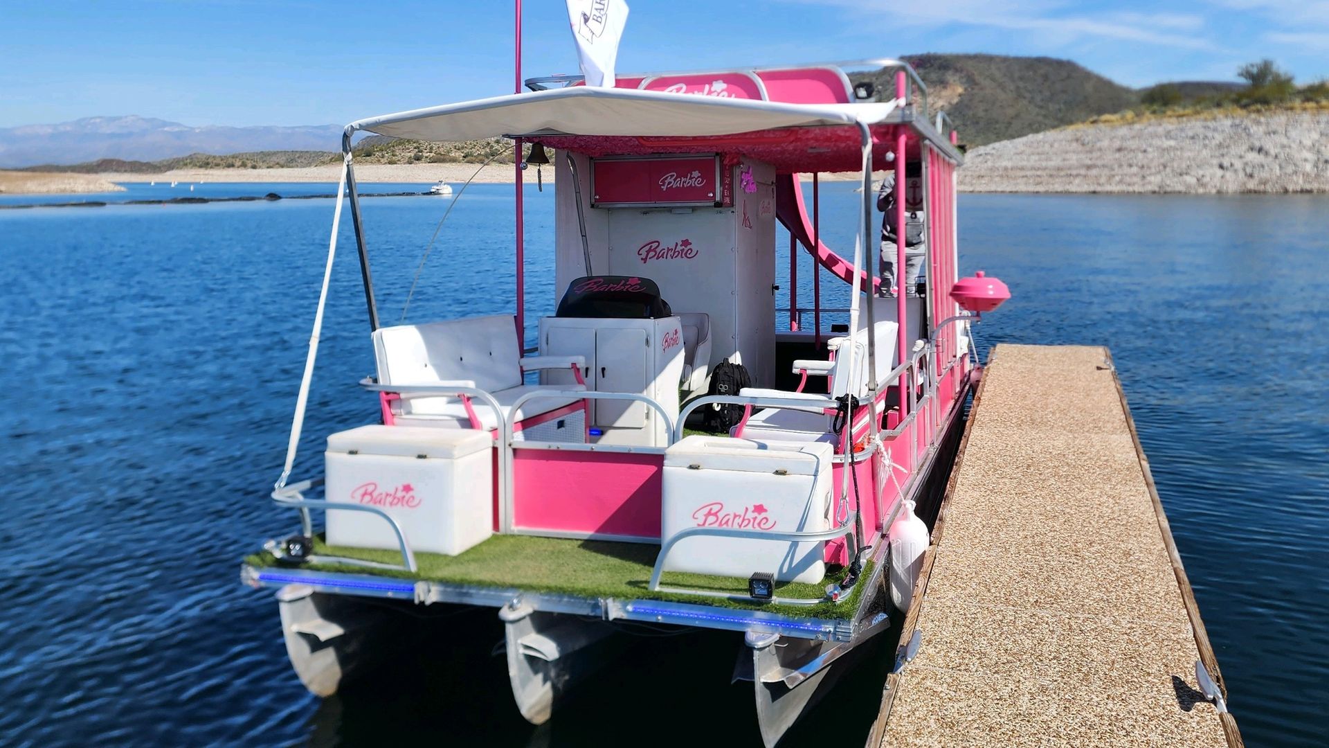 A Barbie-themed pontoon boat.