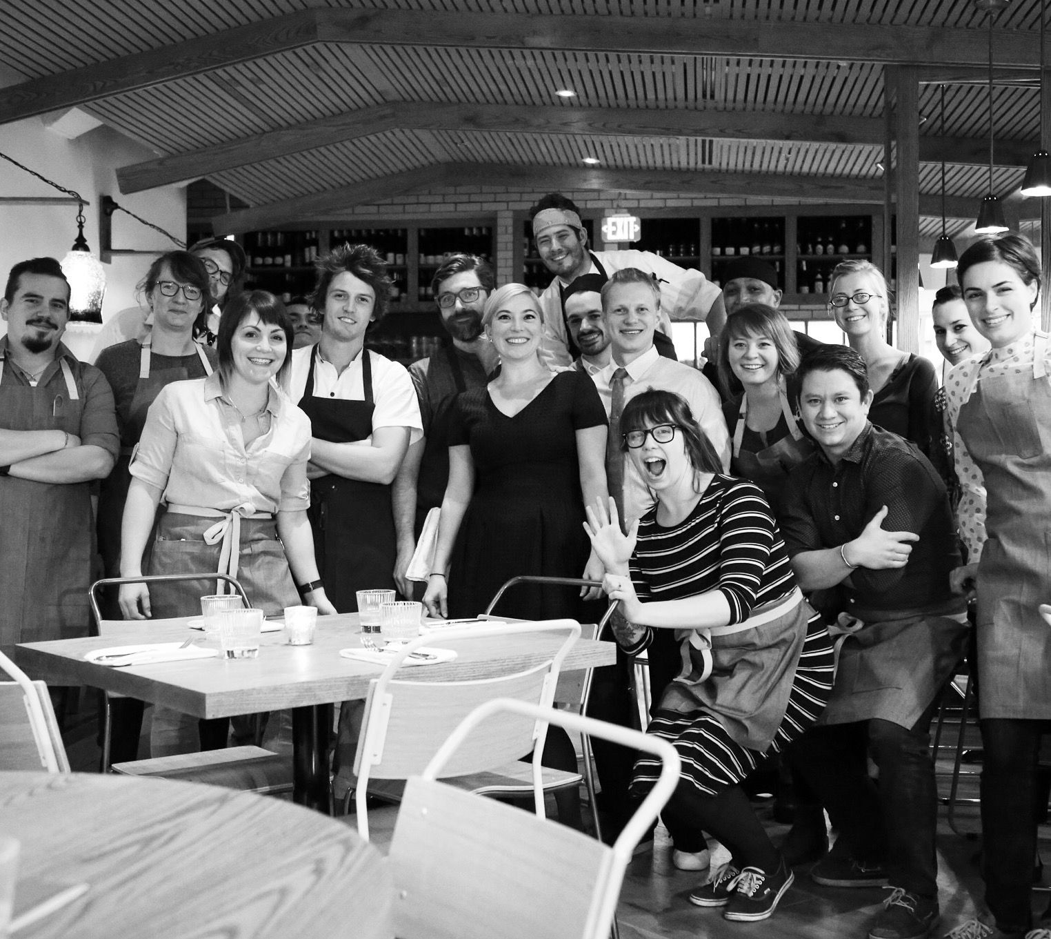 A black and white photo of the Tail Up Goat staff after their first service
