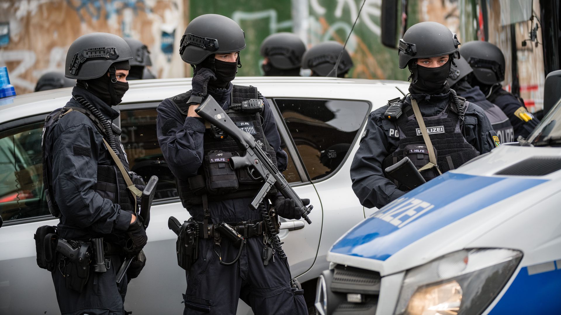 Police block access to a street near the scene of a shooting that has left two people dead 