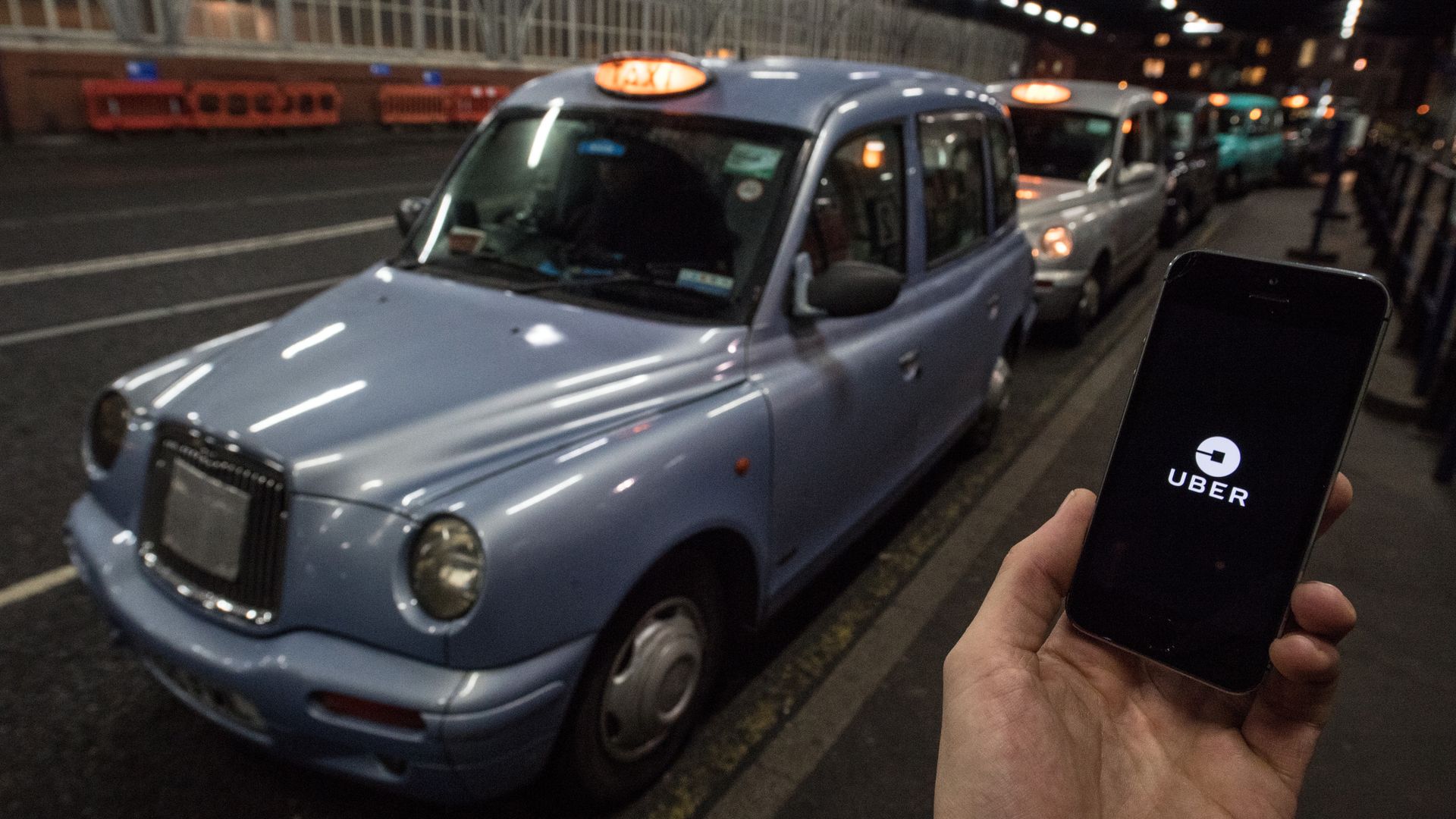 Rider users Uber app in London