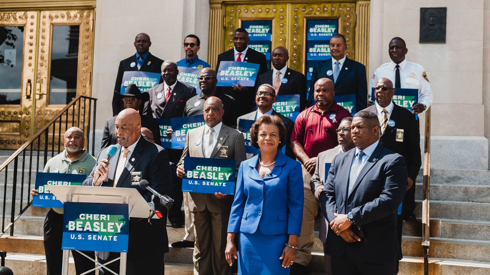 Cheri Beasley at a press conference Monday, Aug. 29, with current and former law enforcement officers. 