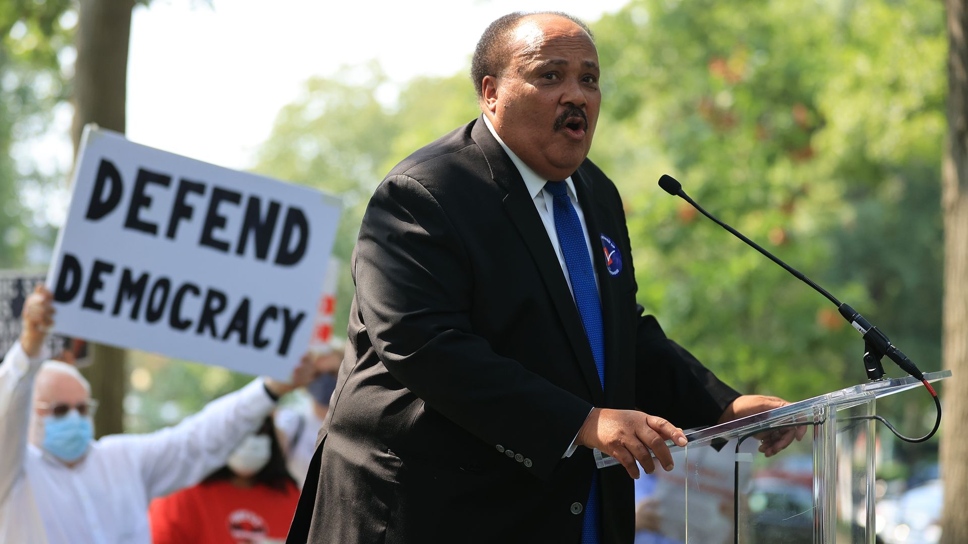 Martin Luther King III is seen speaking at a rally.