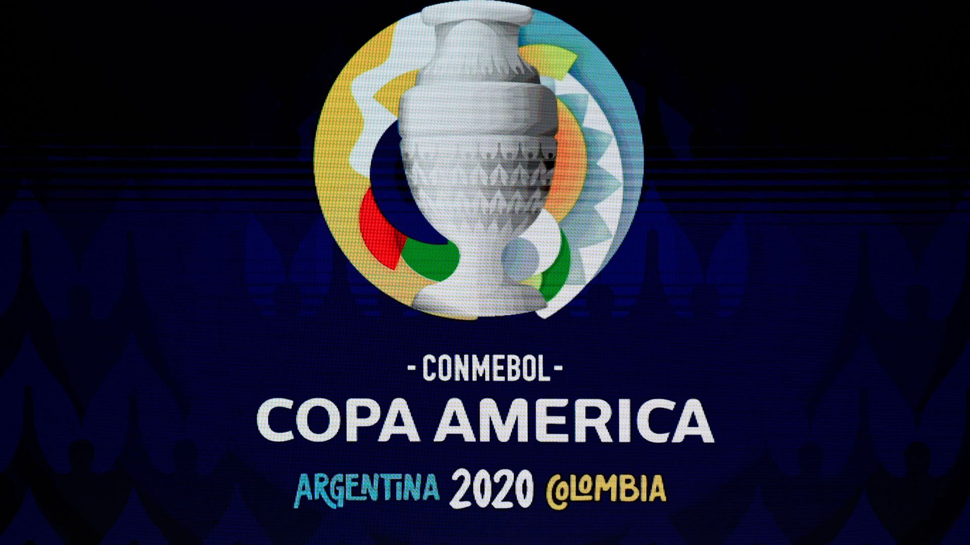 A screen displays the logo of the Copa America 2020 during the draw of the football tournament at the Convention Centre in Cartagena, Colombia, on December 3, 2019.