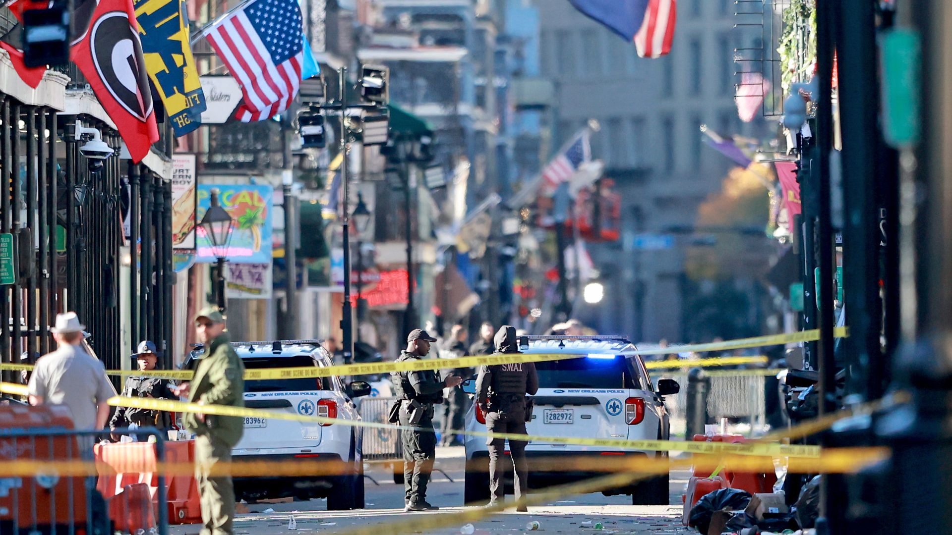 NEW ORLEANS, LOUISIANA - JANUARY 1: Law enforcement officers from multiple agencies work the scene on Bourbon Street after at least ten people were killed when a person allegedly drove into the crowd in the early morning hours of New Year's Day on January 1, 2025 in New Orleans, Louisiana. Dozens mo