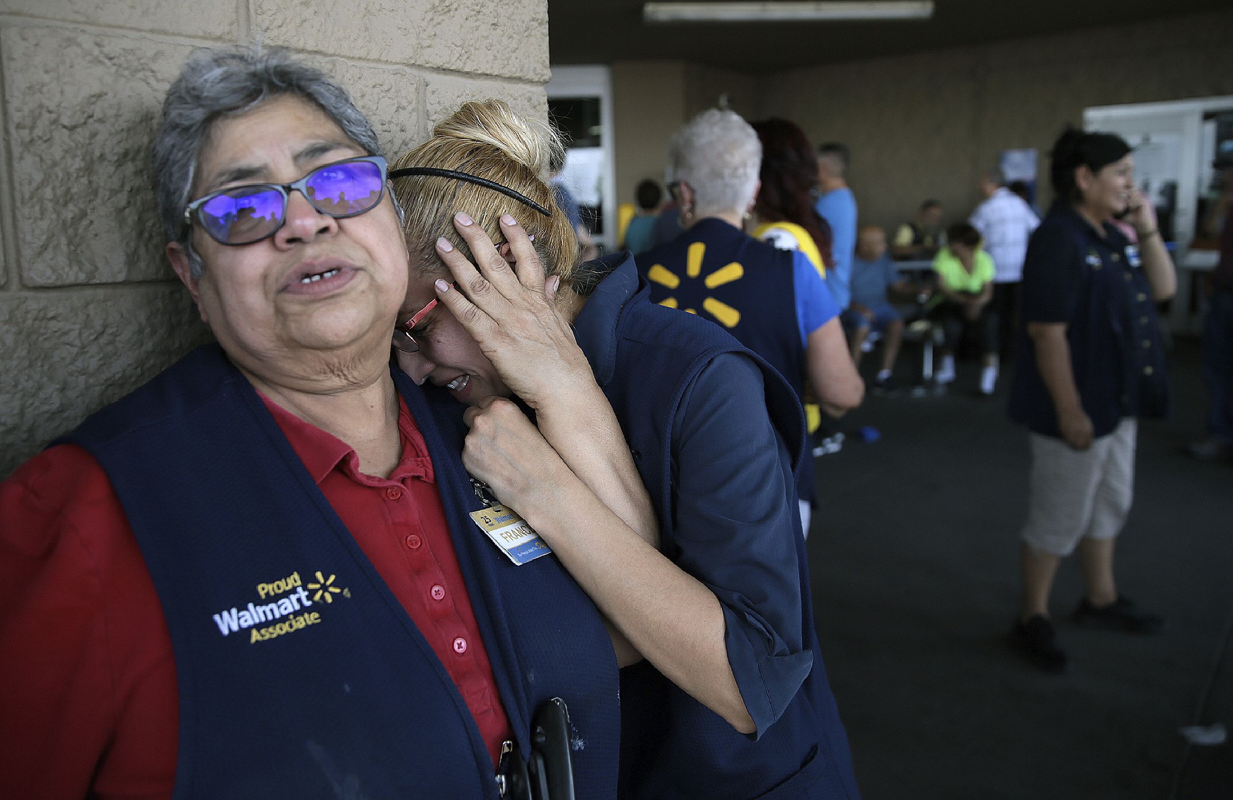 PreviousNext Walmart employees react after an active shooter opened fire at the store in El Paso, Texas, Saturday, Aug. 3
