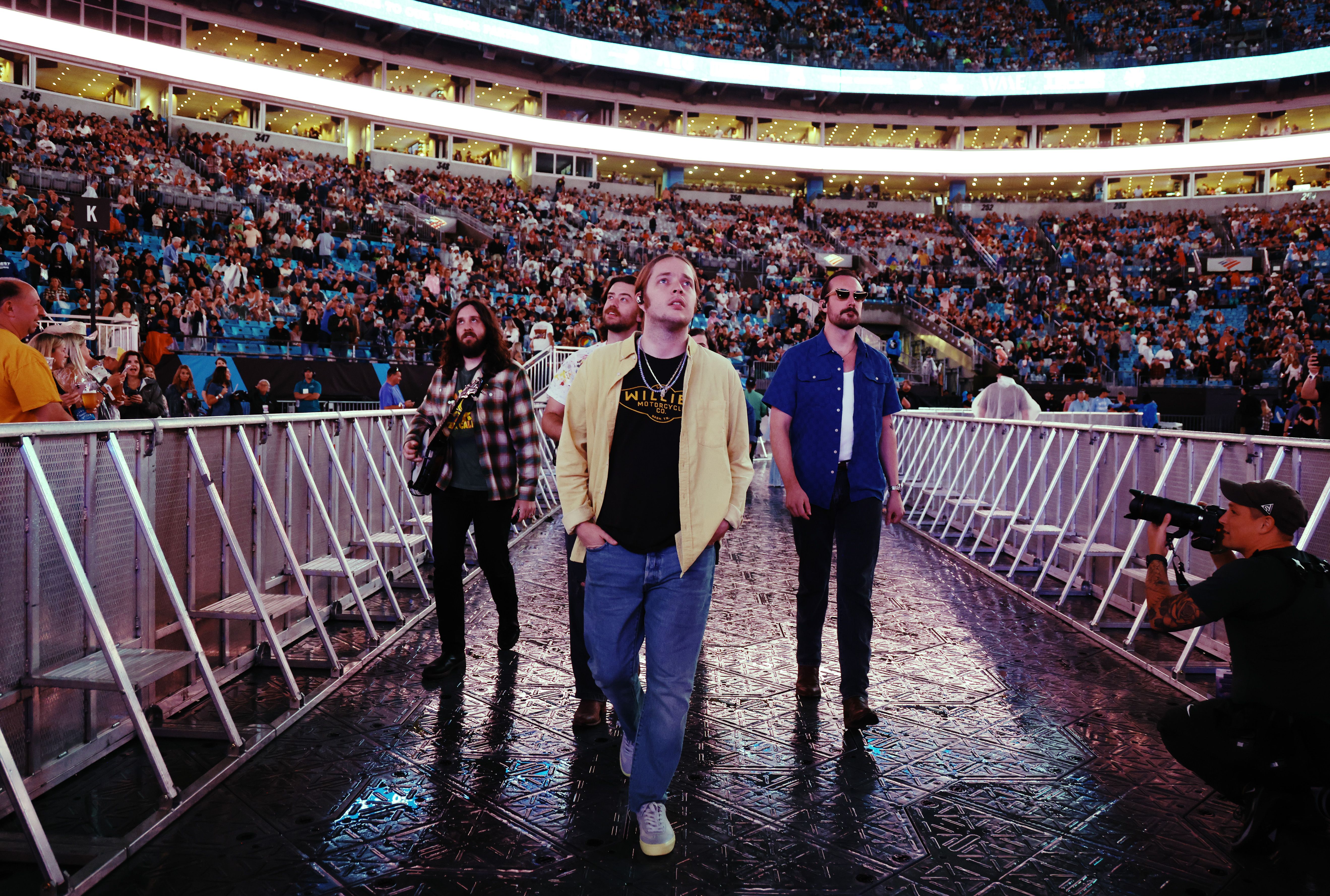 Billy Strings walks to the stage at the Concert For Carolina Benefit Concert at Bank of America Stadium on October 26, 2024 in Charlotte, North Carolina. (Photo by John Shearer/Getty Images for Concert For Carolina)